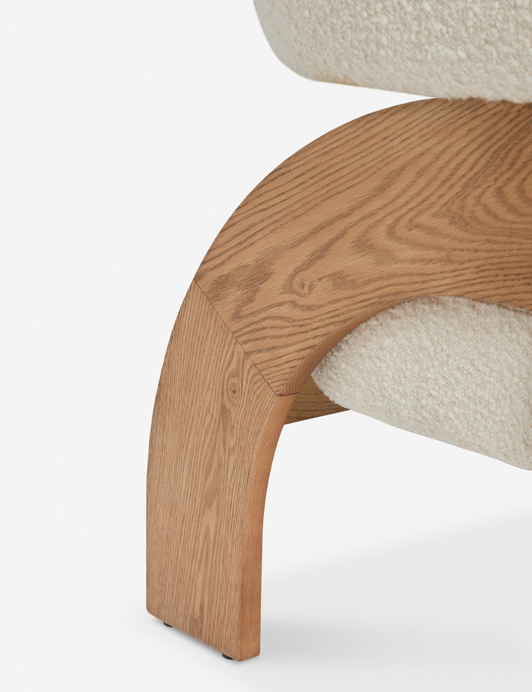 Close up view of the Agacia barrel back boucle upholstered accent chair by Aimee Song