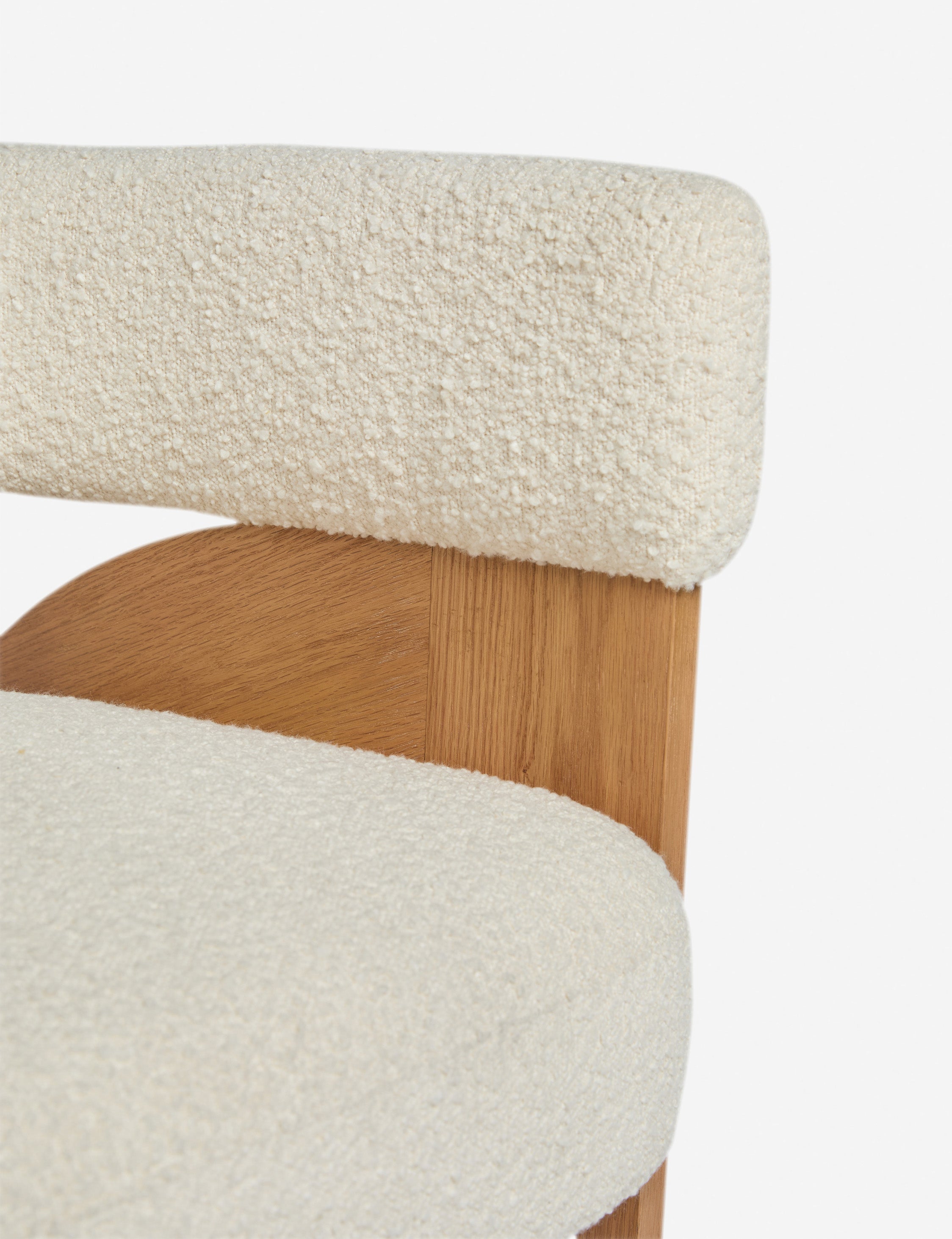 Close up view of the Agacia barrel back boucle upholstered accent chair by Aimee Song