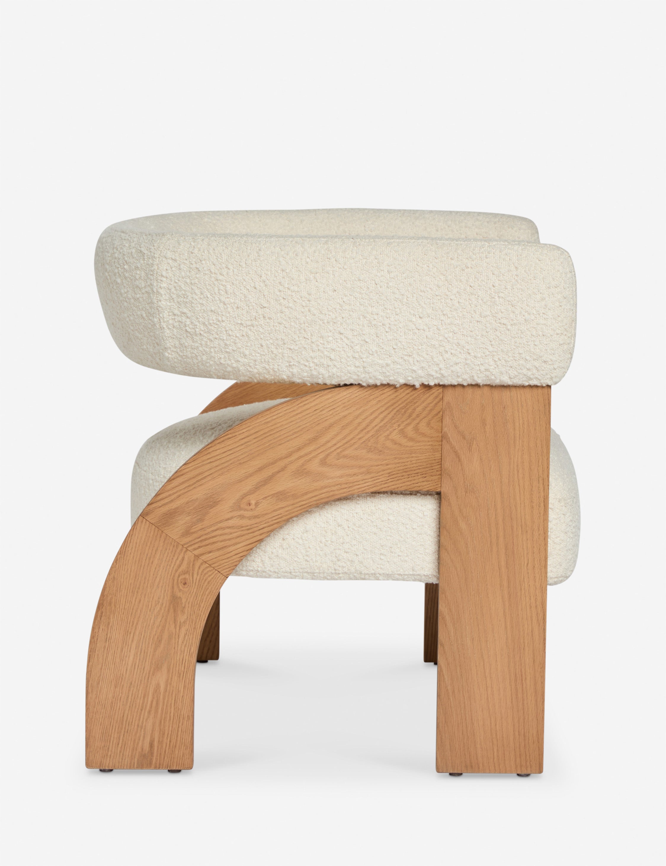 Side profile view of the Agacia barrel back boucle upholstered accent chair by Aimee Song
