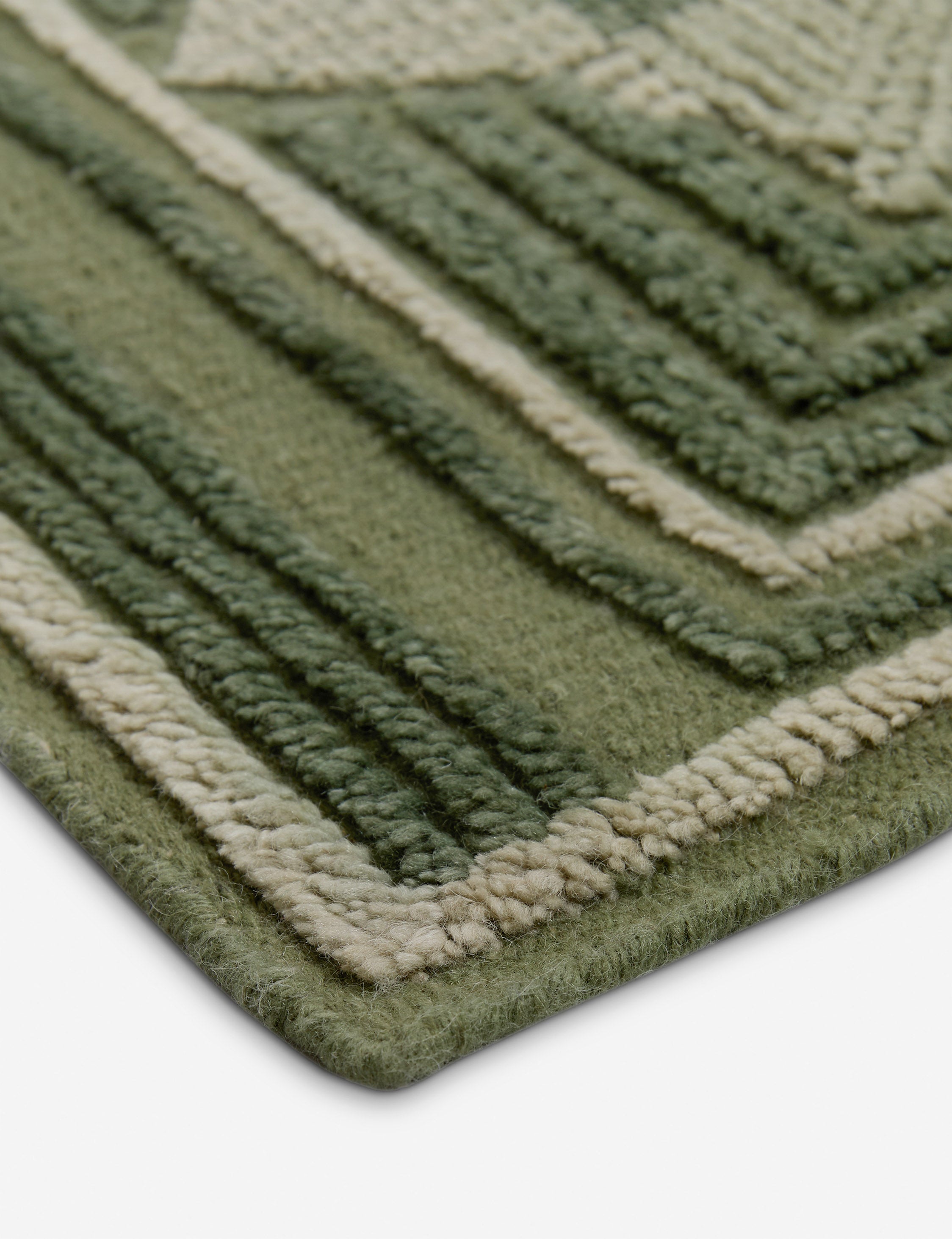 Close up of the corner of the Carlisle Geometric Motif Hand-Knotted Wool Rug by Aimee Song