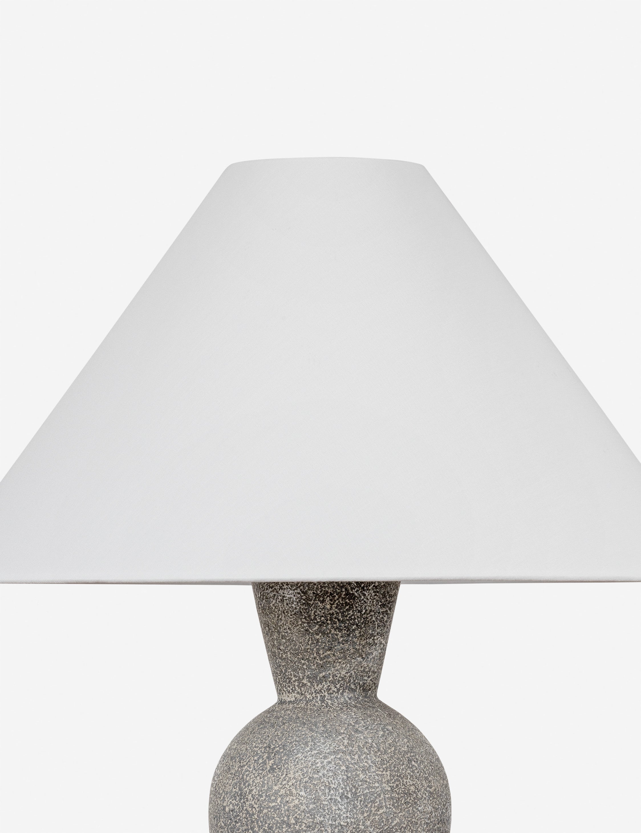 Close up of the Bulsara geometric, stone-finish ceramic table lamp