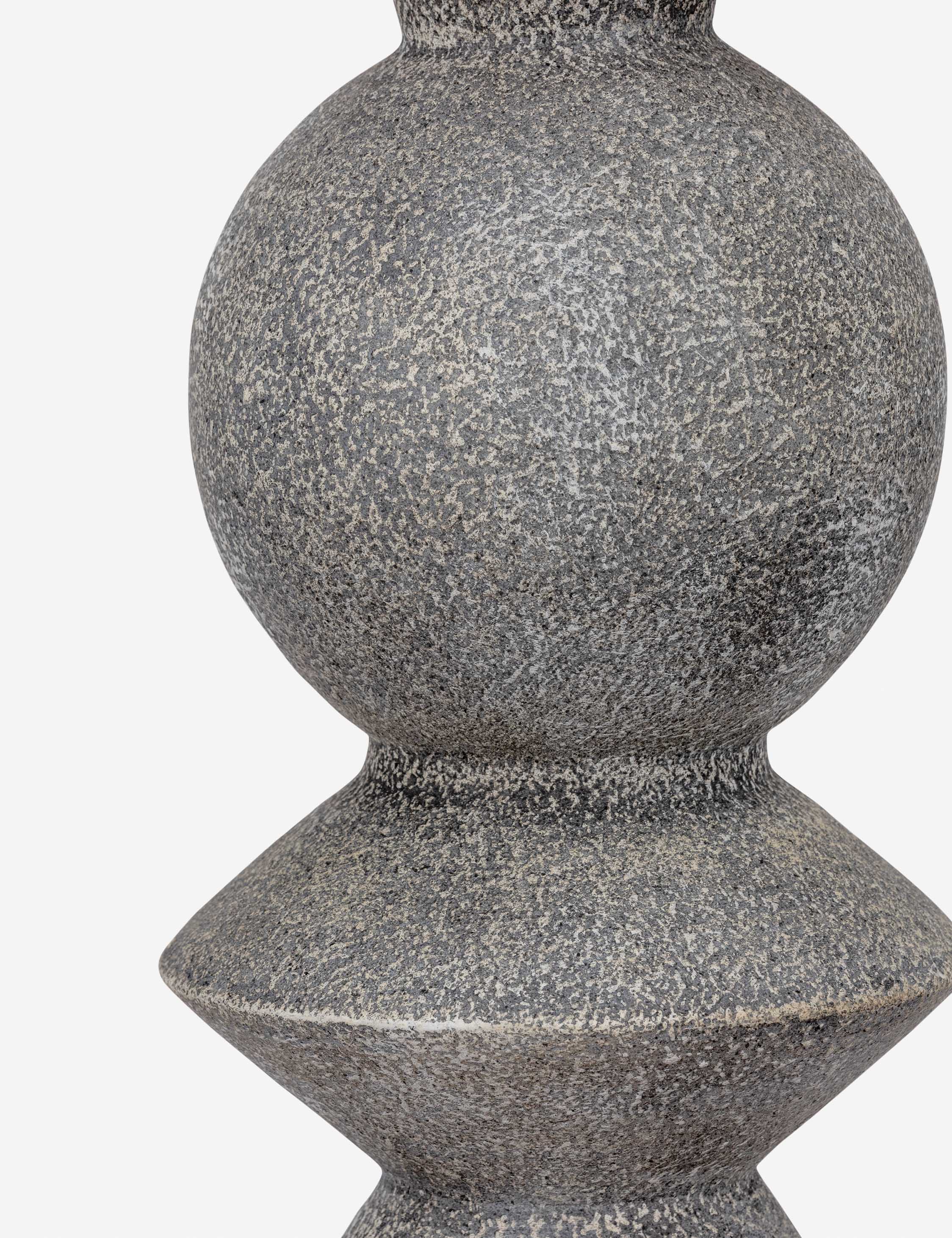 Close up of the base of the Bulsara geometric, stone-finish ceramic table lamp