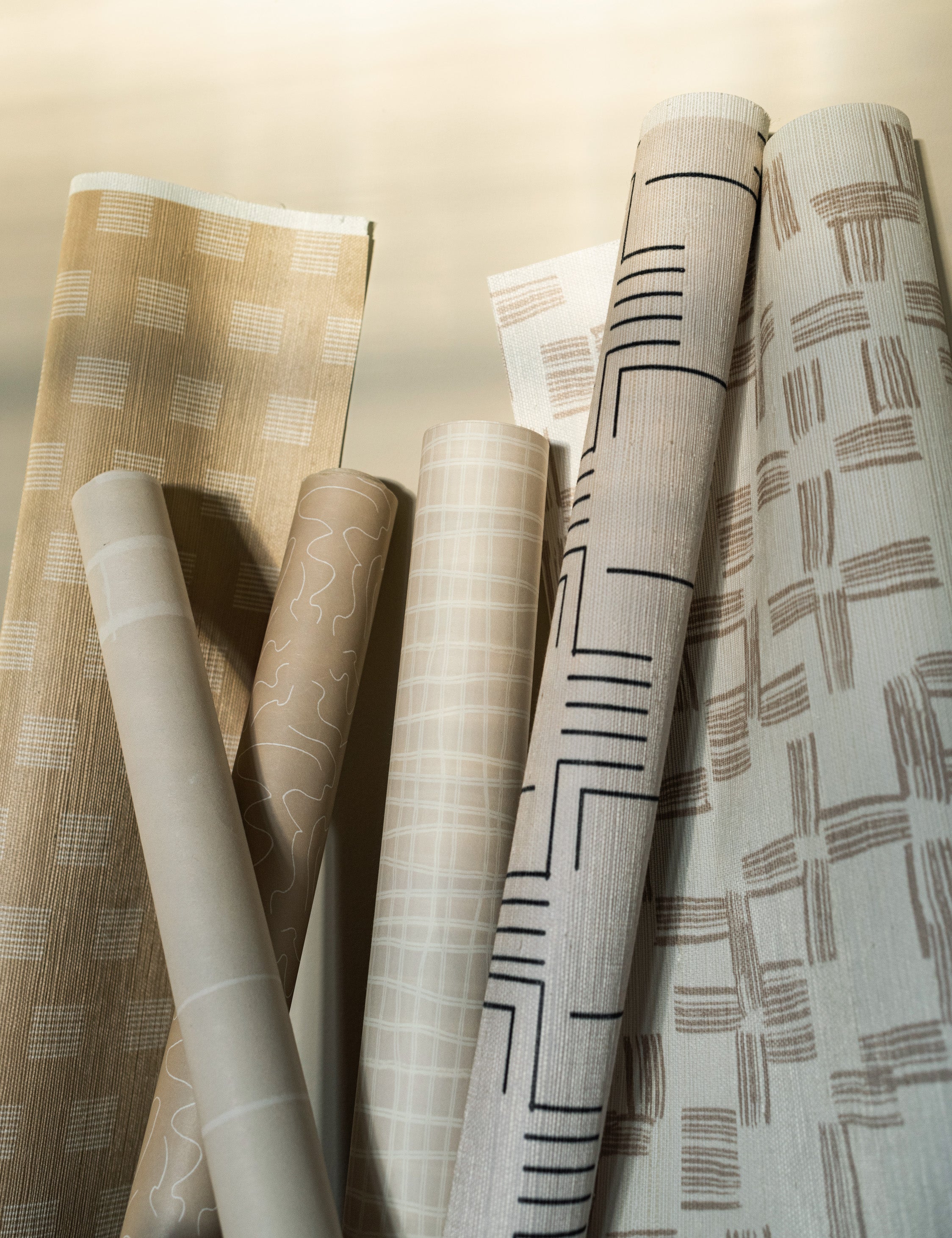 Roll of the Sand Dune Grasscloth Wallpaper by Élan Byrd.