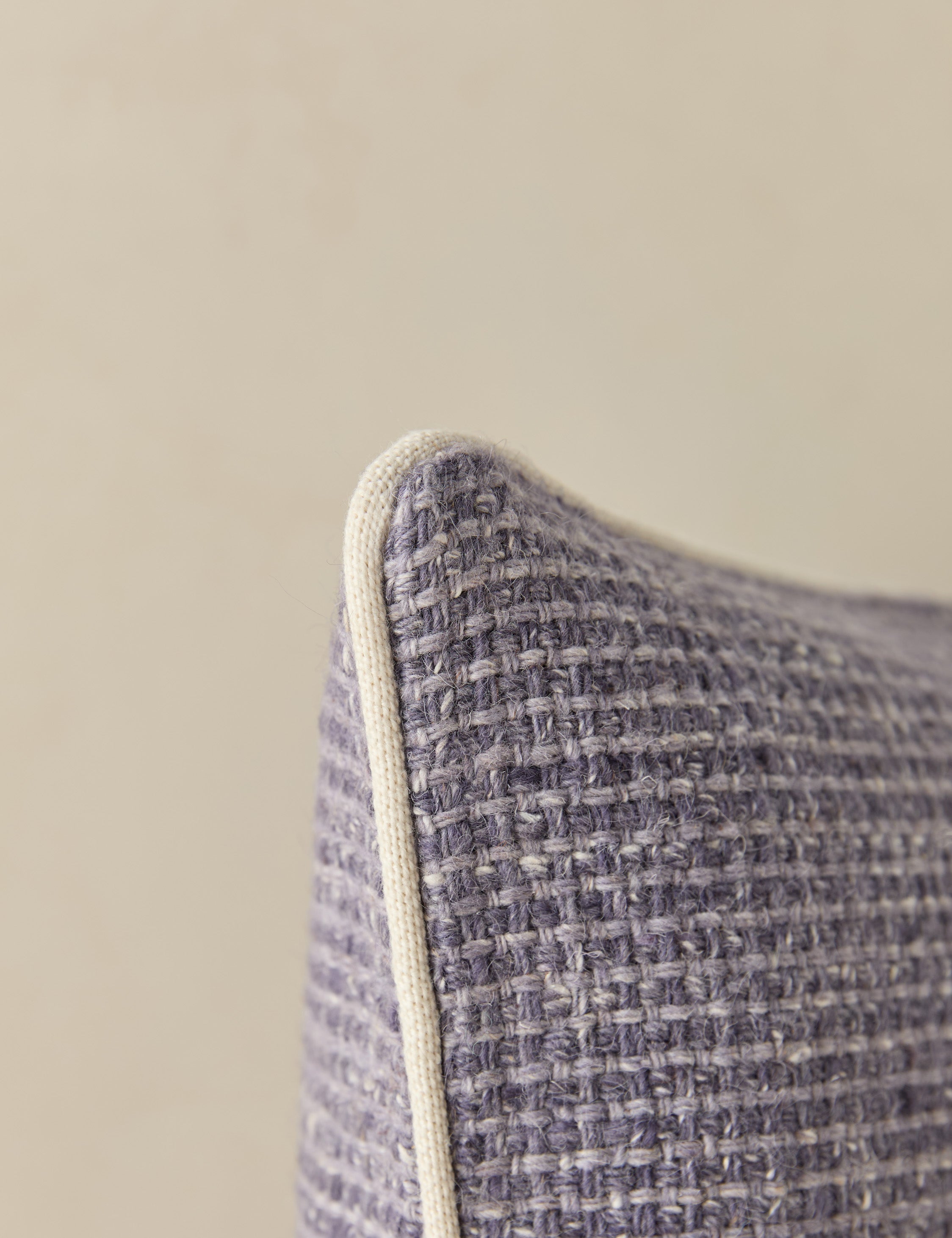 Close up view of the corner of the Enzi tactile tweed pillow by Aimee Song