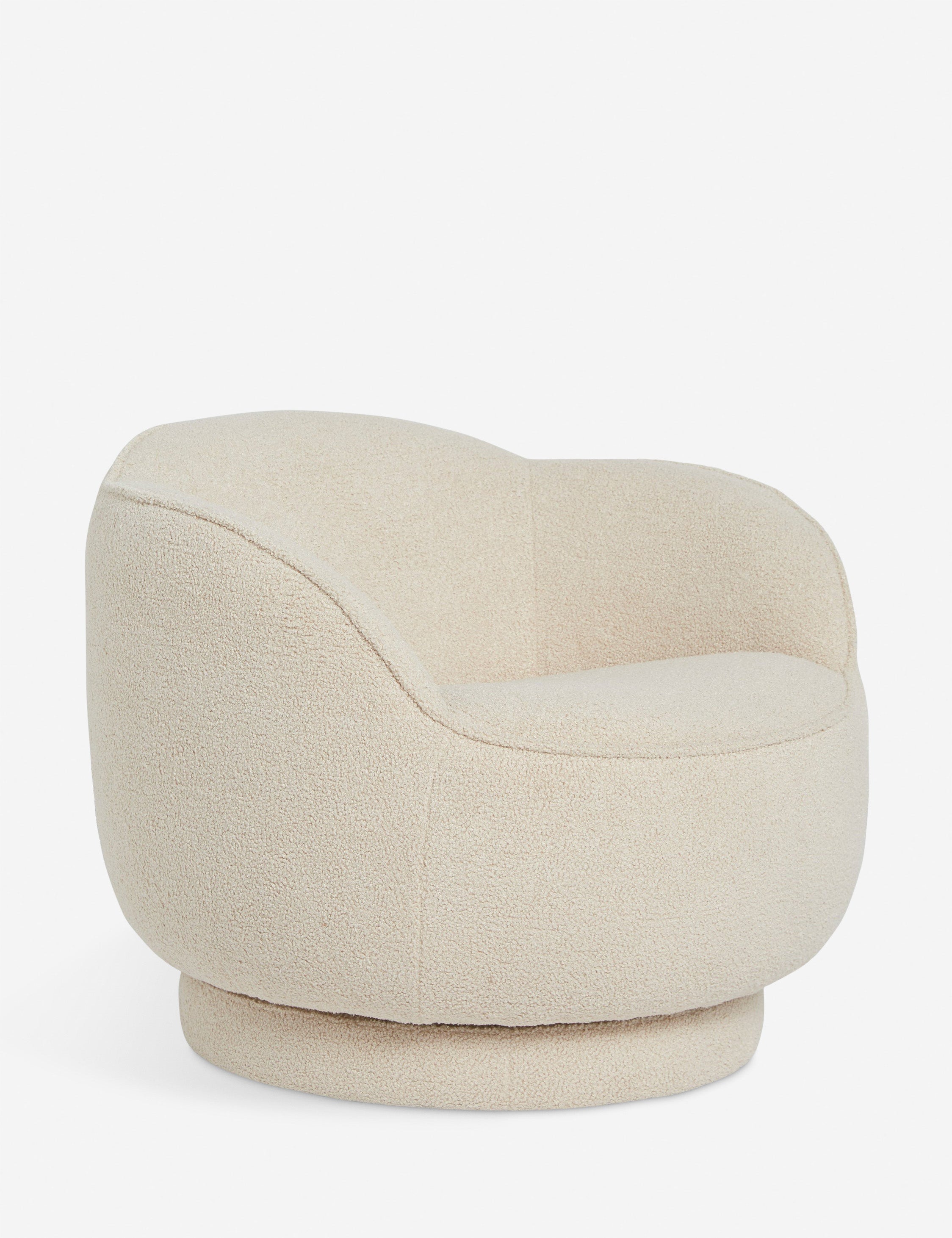 Angled view of the Fern scalloped back boucle upholstered swivel chair