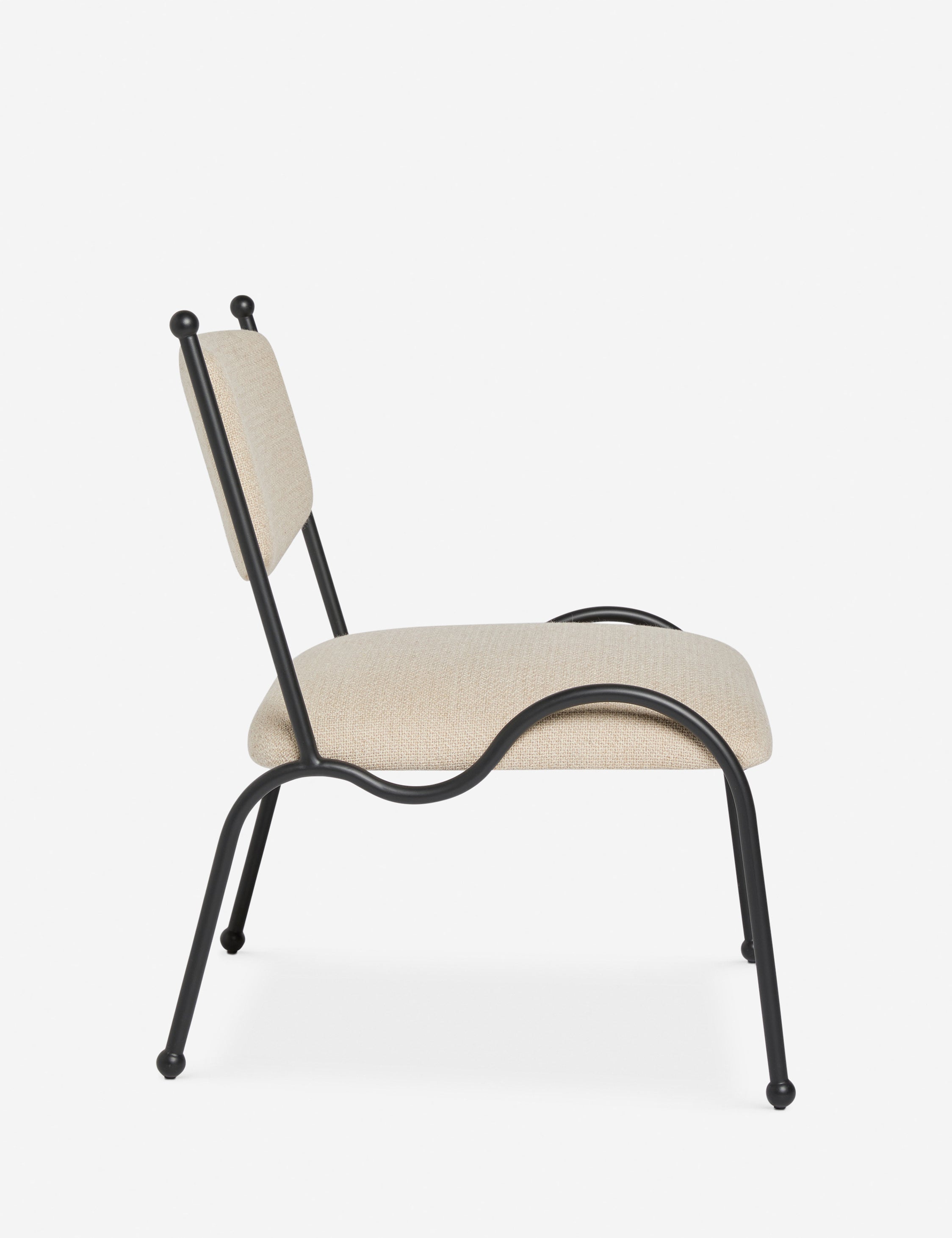 Side profile view of the Fidia curved metal silhouette accent chair by Aimee Song
