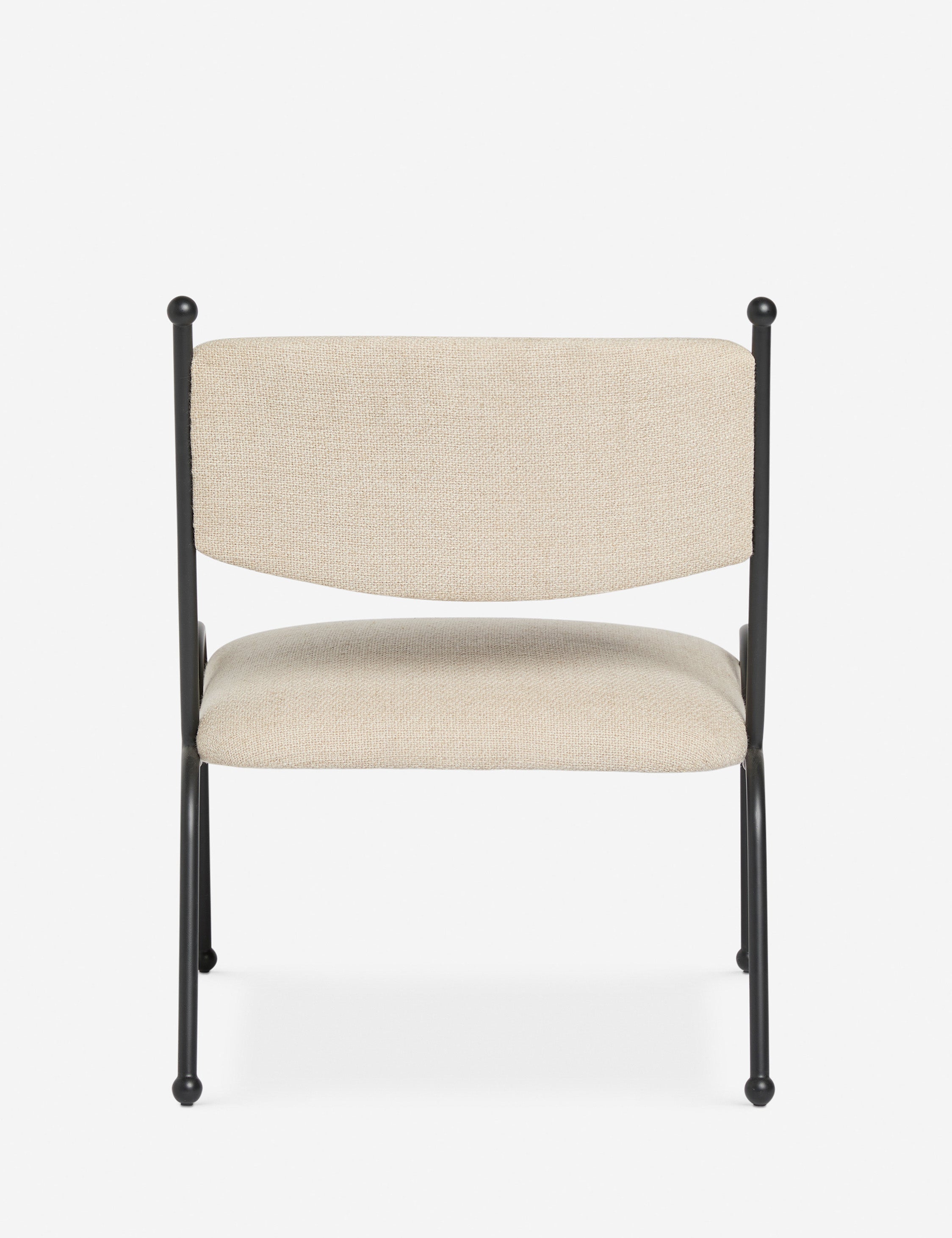 Back view of the Fidia curved metal silhouette accent chair by Aimee Song