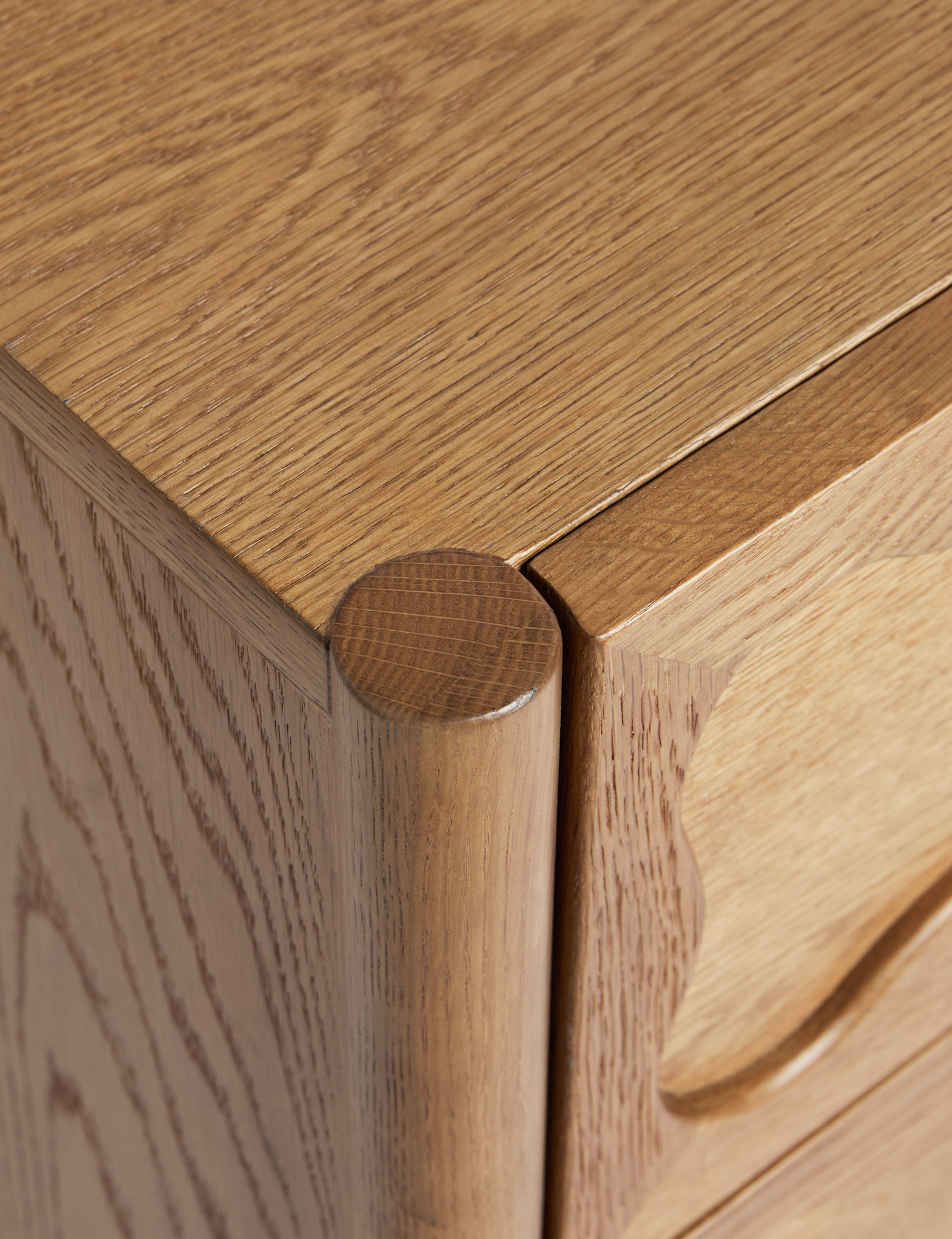 Close up view of the Fontaine wavy detailing solid oak 6-drawer dresser by Aimee Song