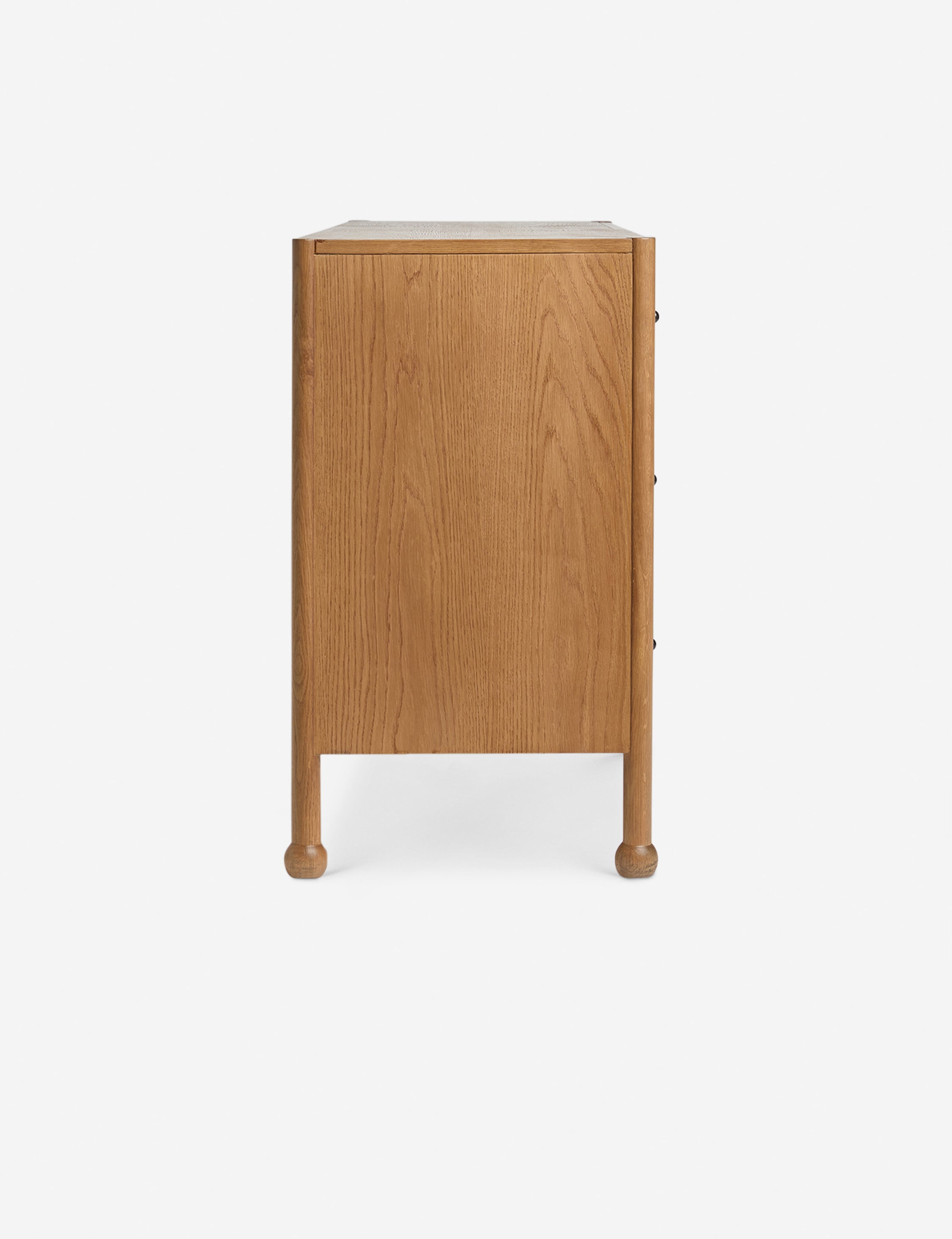 Side profile view of the Fontaine wavy detailing solid oak 6-drawer dresser by Aimee Song