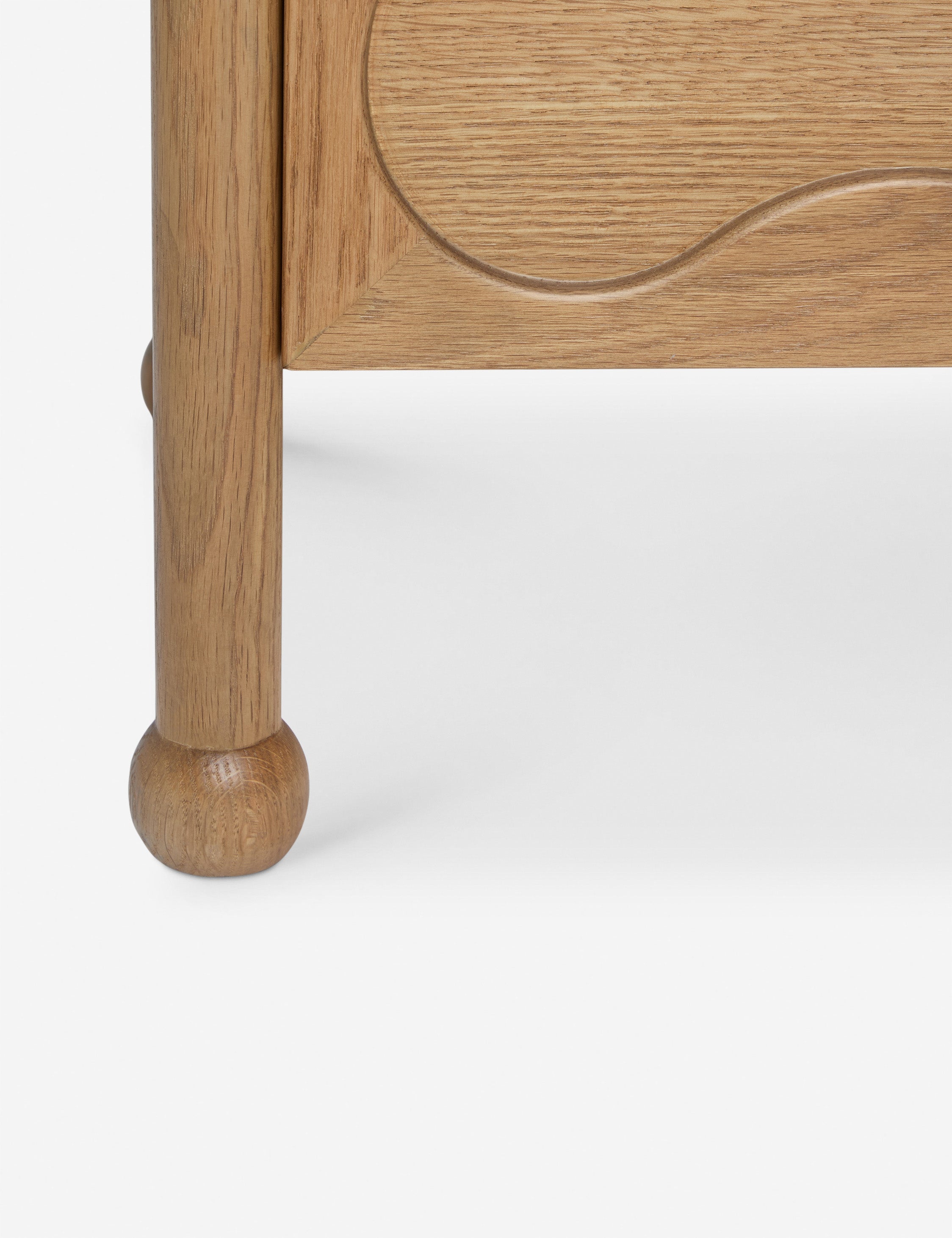 Close up view of the Fontaine wavy detailing solid oak sideboard by Aimee Song
