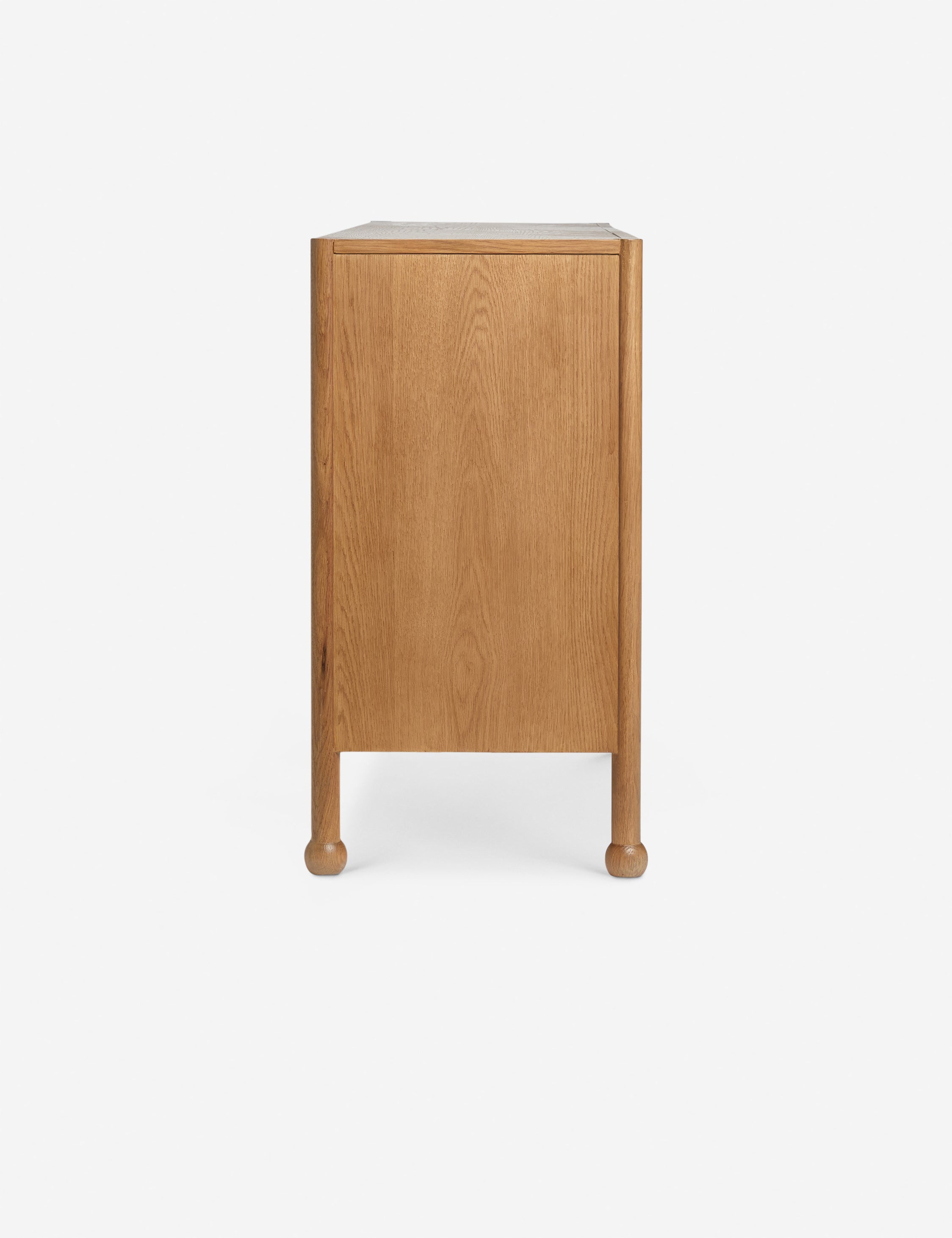 Side profile of the Fontaine wavy detailing solid oak sideboard by Aimee Song