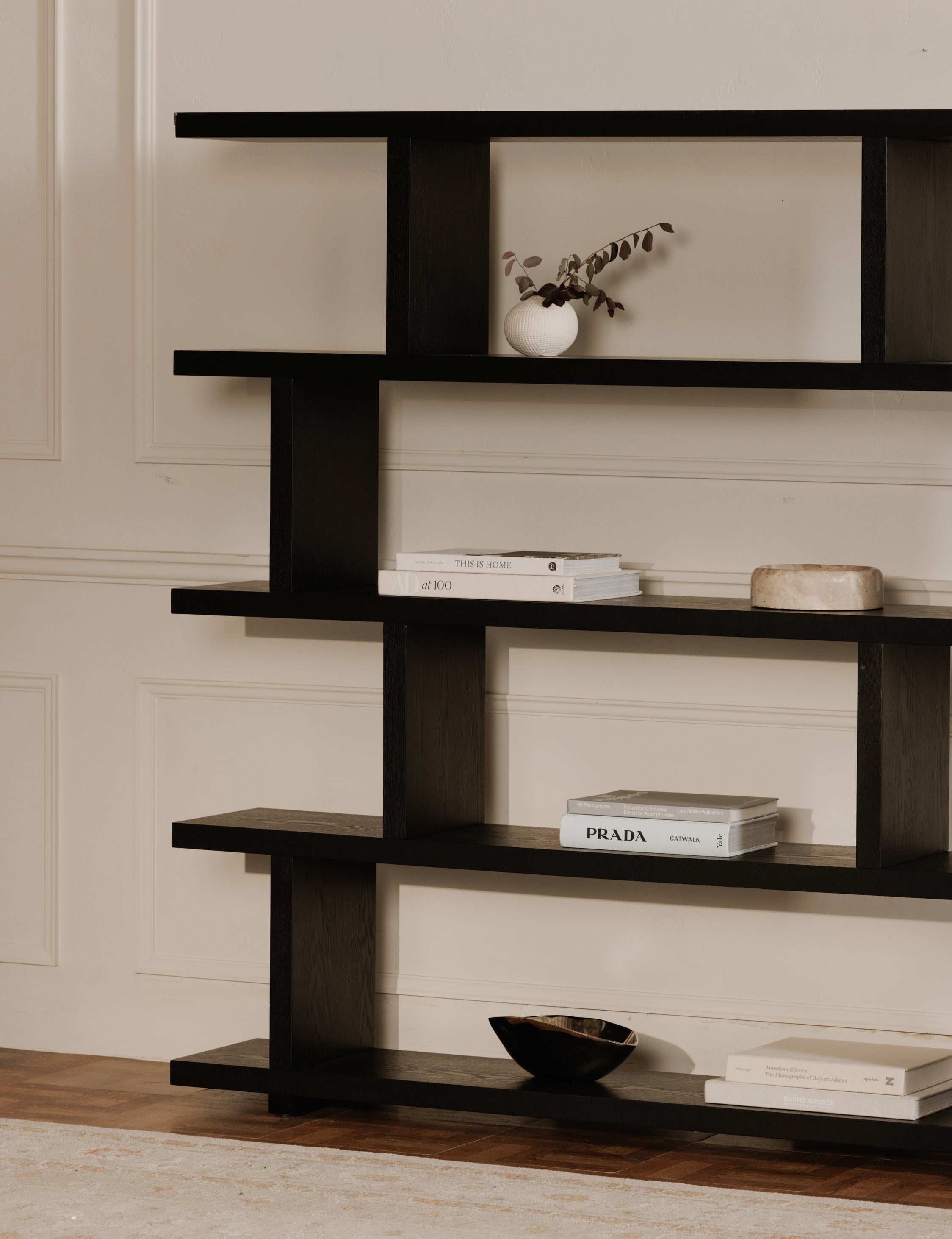 Balland round marble catchall styled on a bookshelf