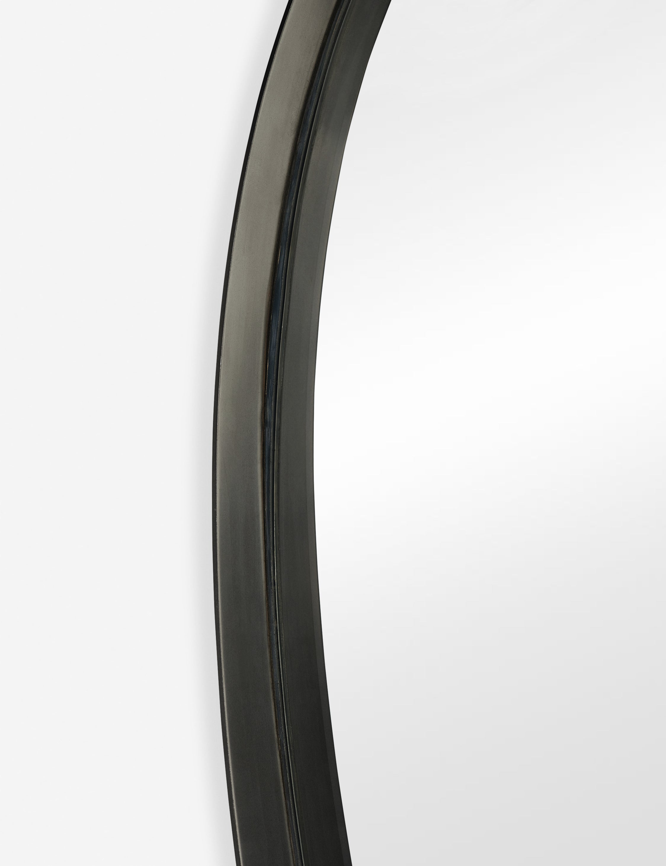 Close up view of the frame of the Leganza slim frame organic silhouette full length mirror by Aimee Song