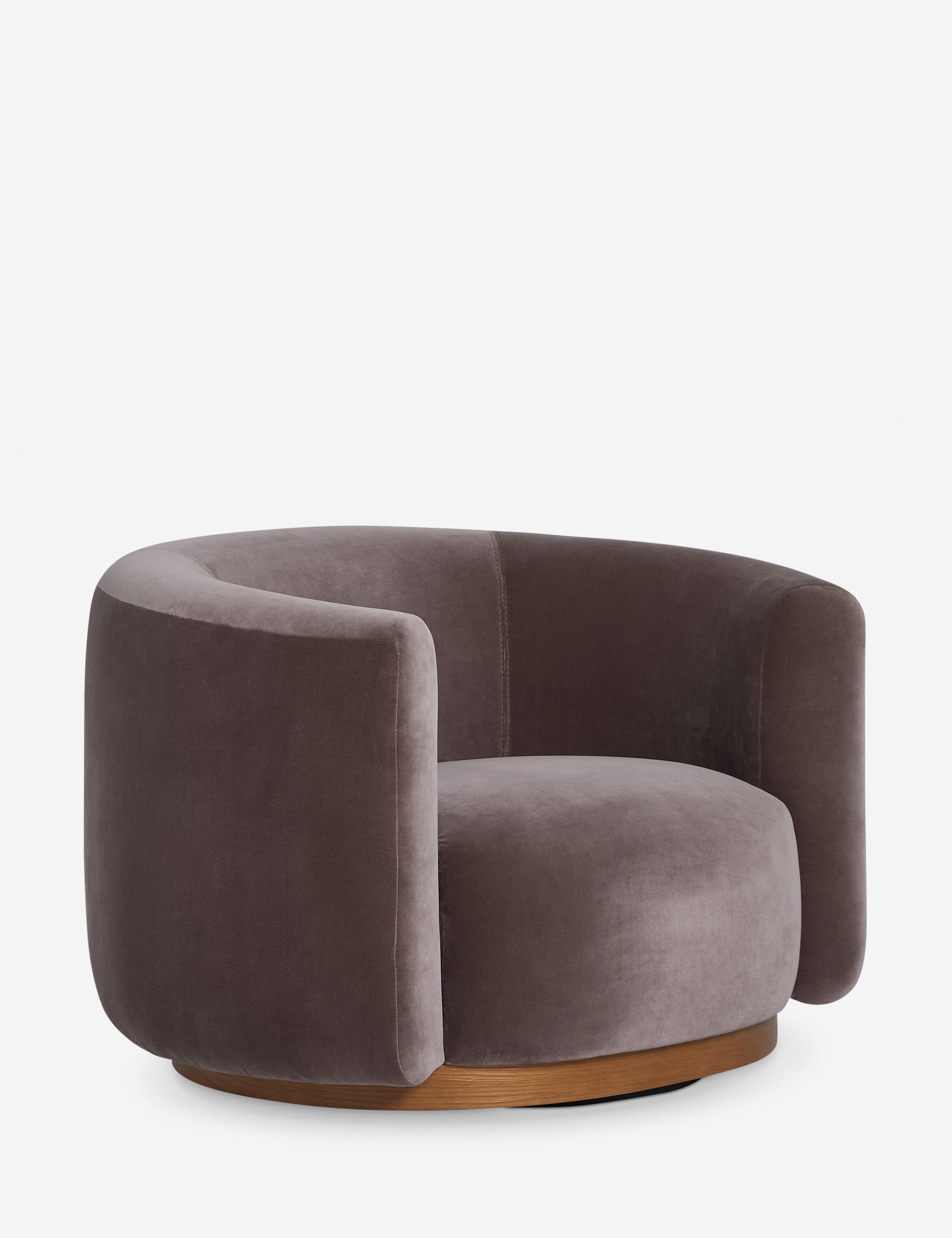 Angled view of the Lowry rounded silhouette velvet accent chair.