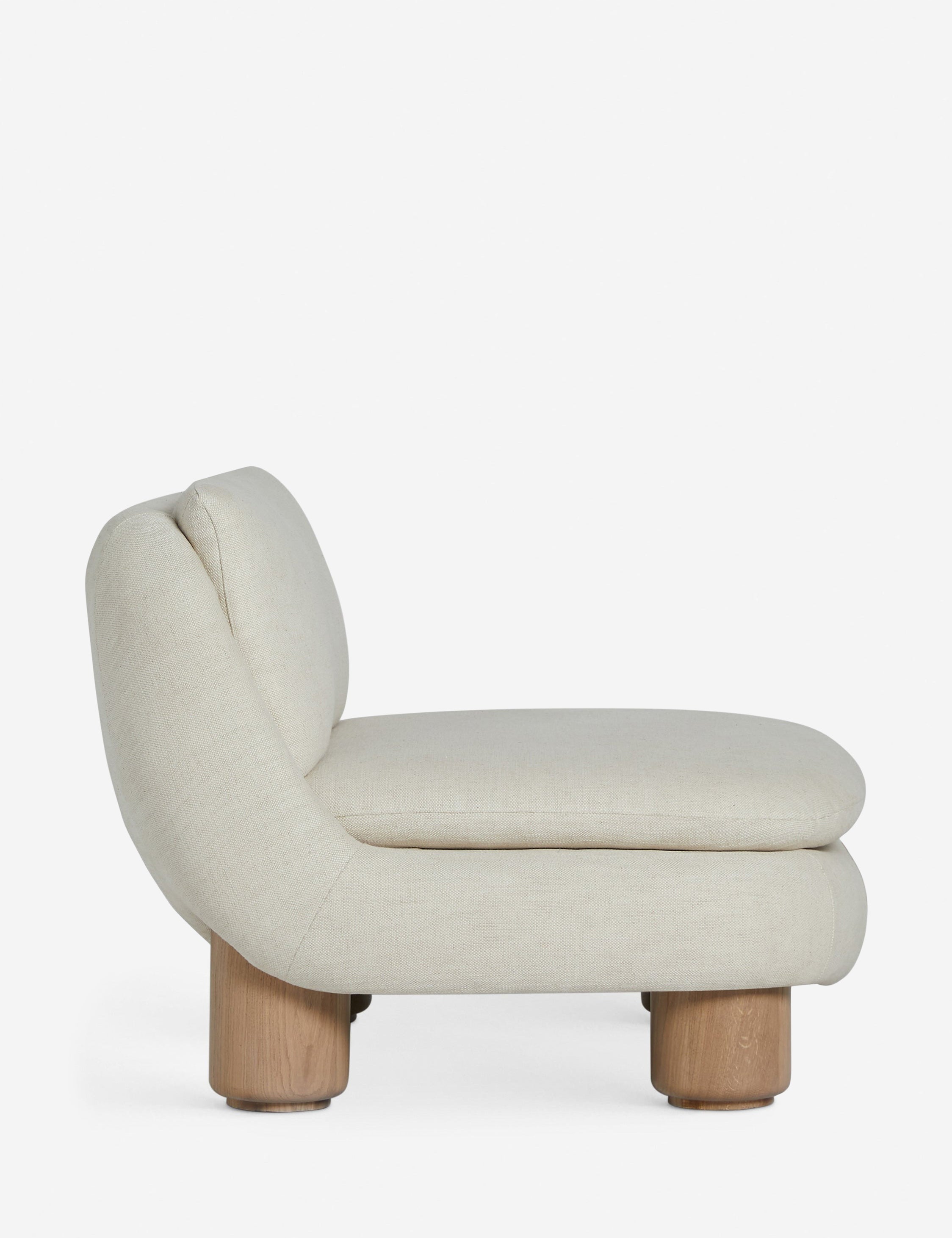 Side profile of the Lozano chunky low-profile armless accent chair.