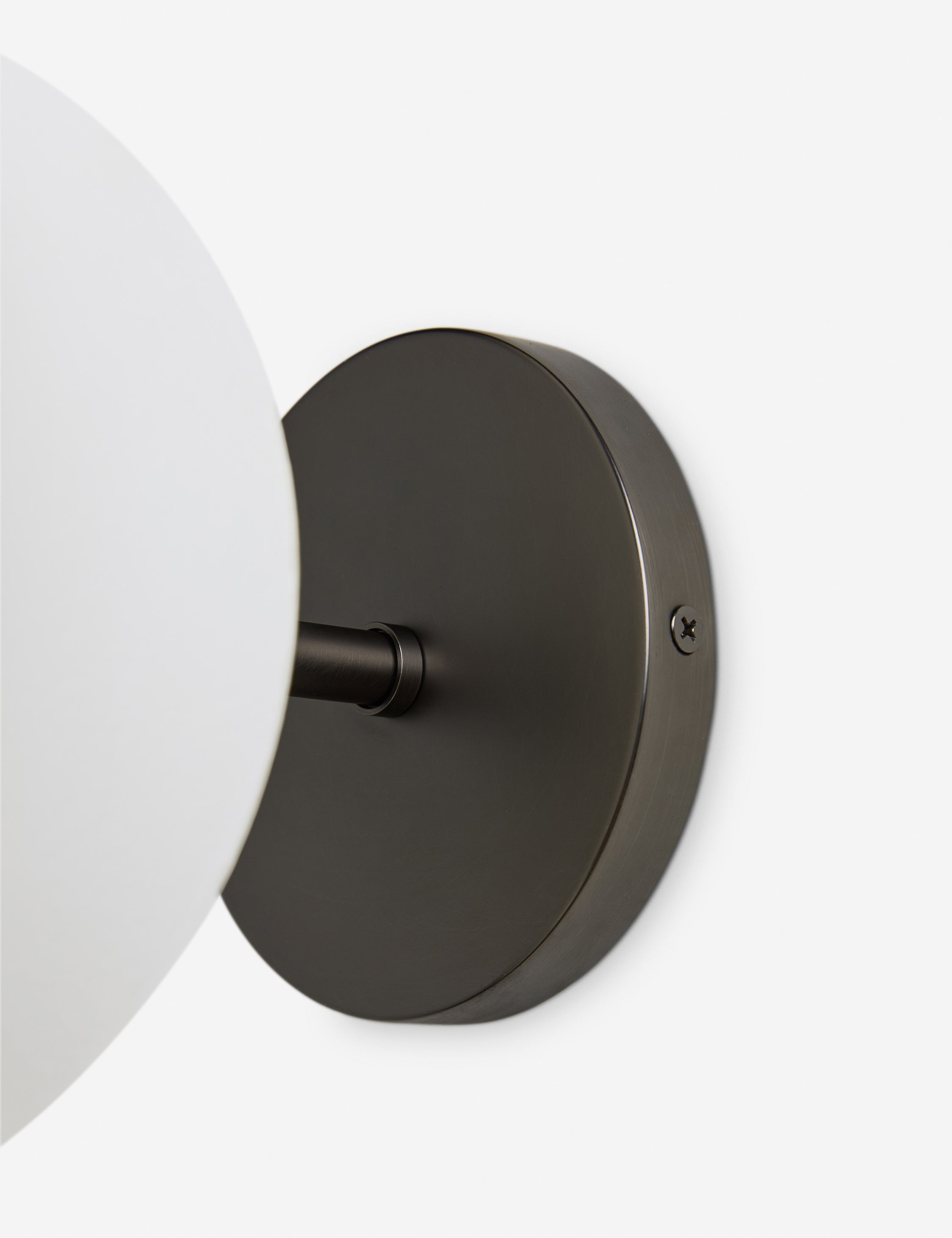 Close up of the backplate of the Luneth stacked lantern shade sconce by Aimee Song