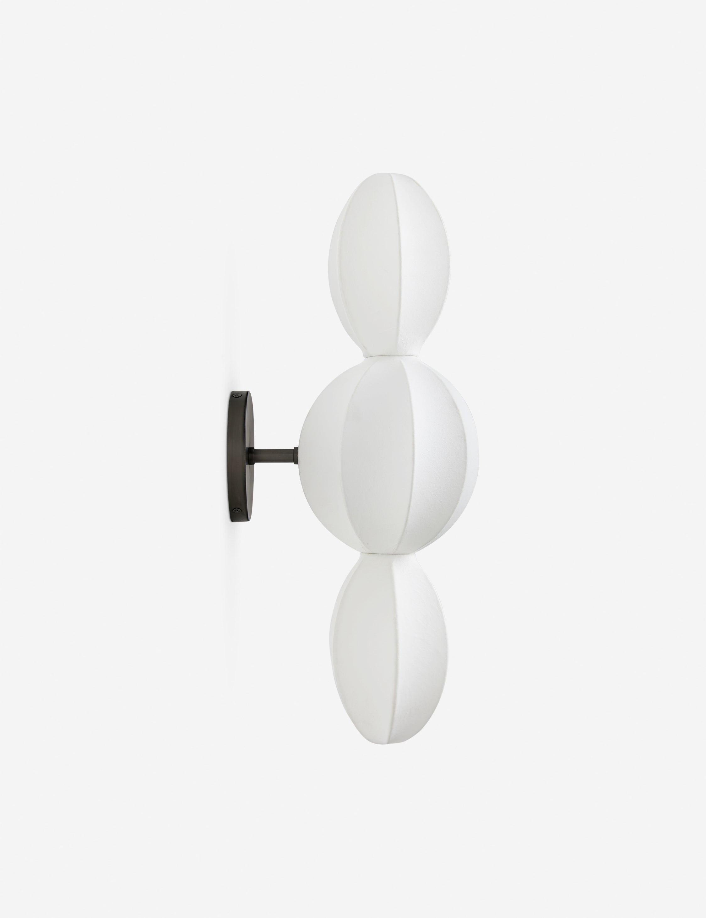 Side profile view of the Luneth stacked lantern shade sconce by Aimee Song