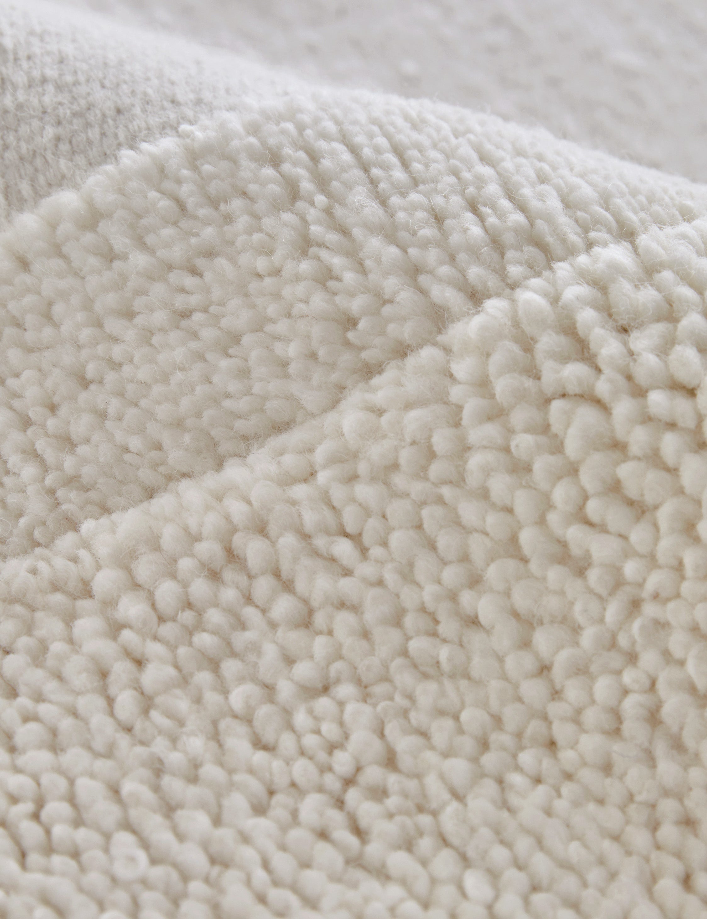 Close up view of the Malta Hi-Lo Pile Hand-Knotted Wool Rug by Aimee Song