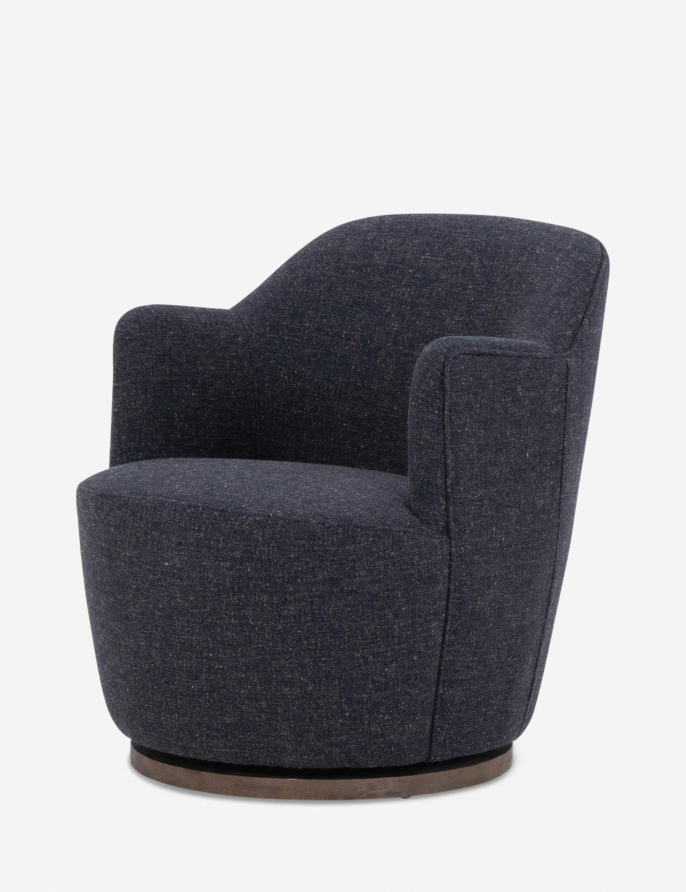 Angled side view of Margie rounded barrel swivel accent chair in slate