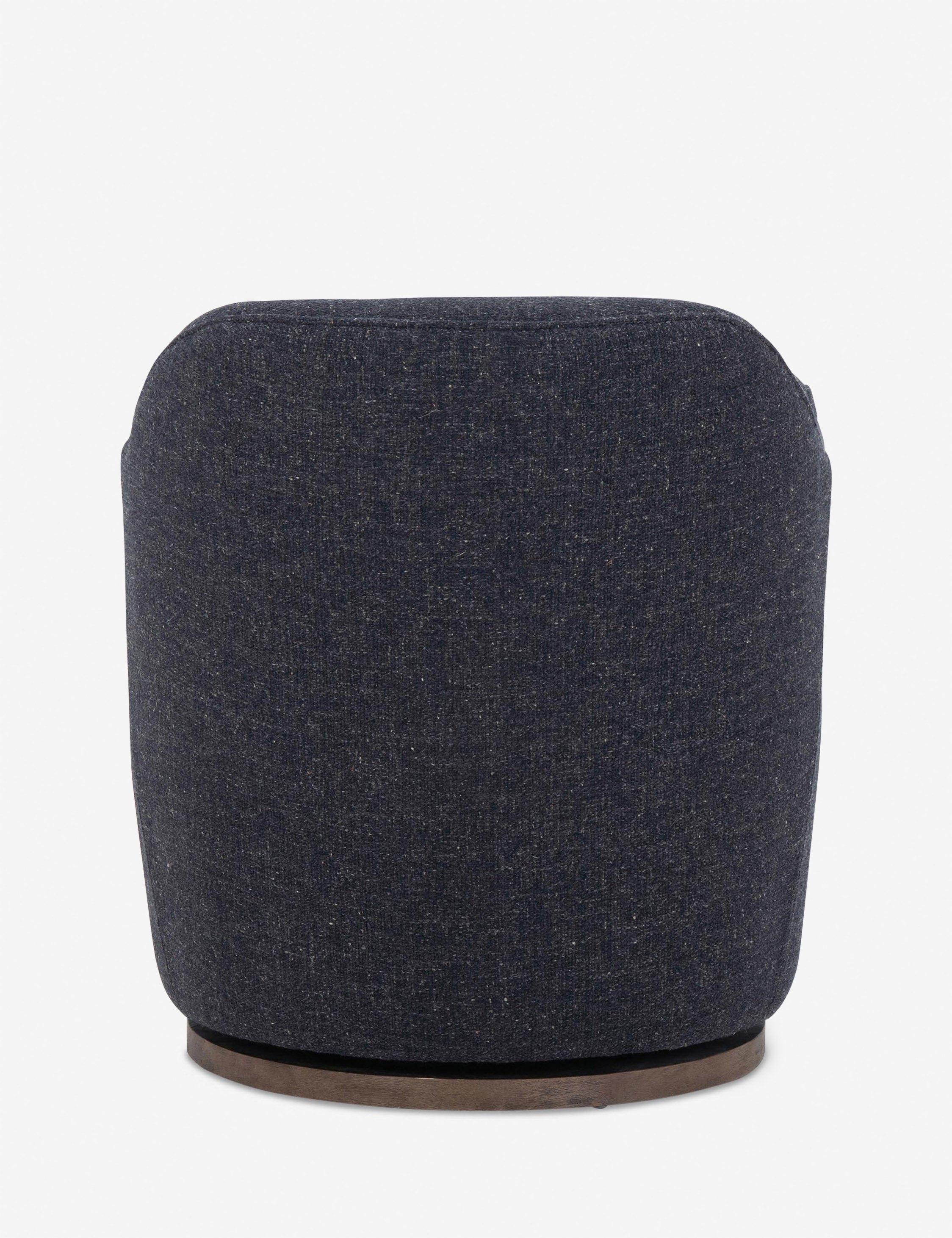 Rear view of Margie rounded barrel swivel accent chair in slate