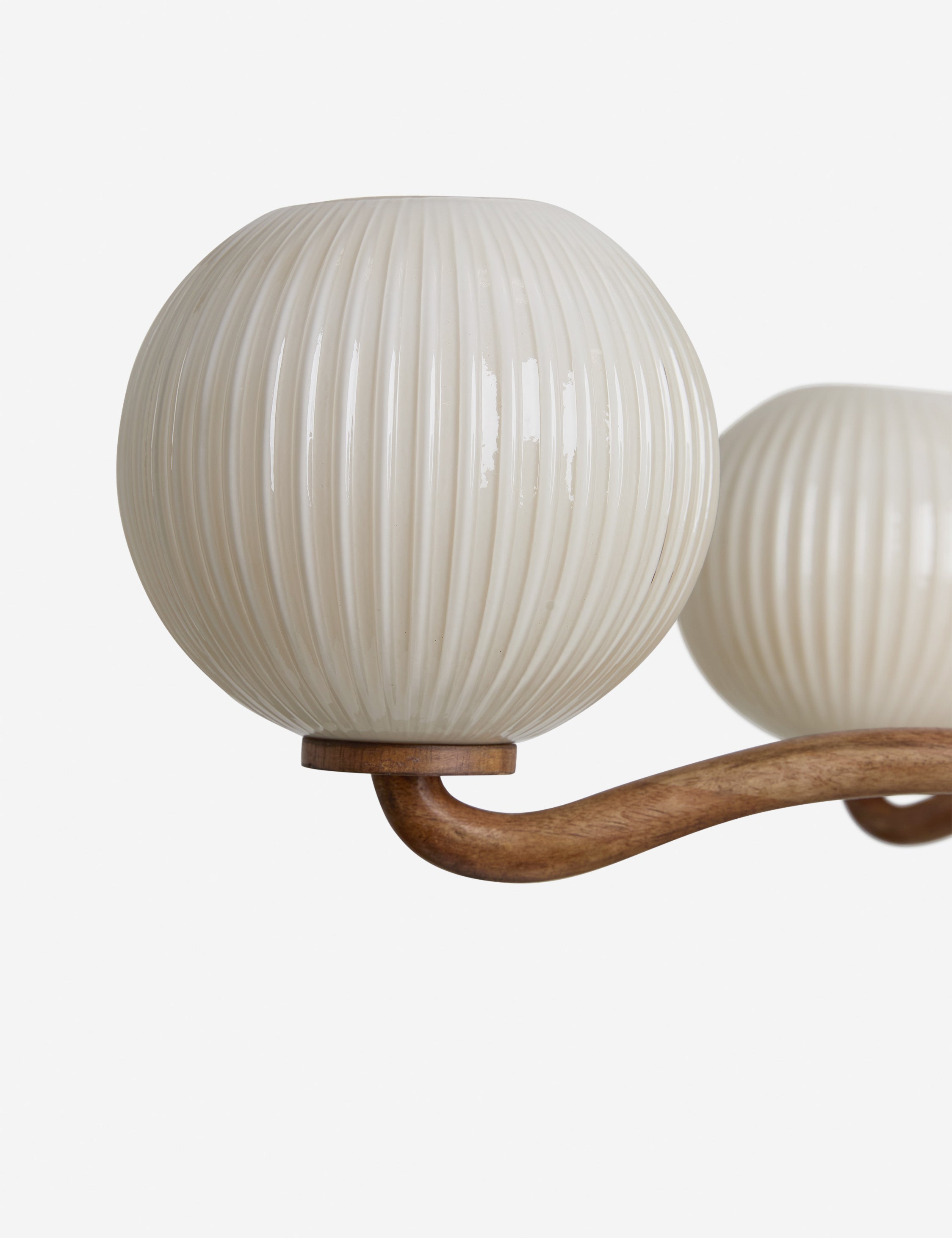 Close up view of the shade of the Nara fluted glass 5-globe chandelier by Aimee Song
