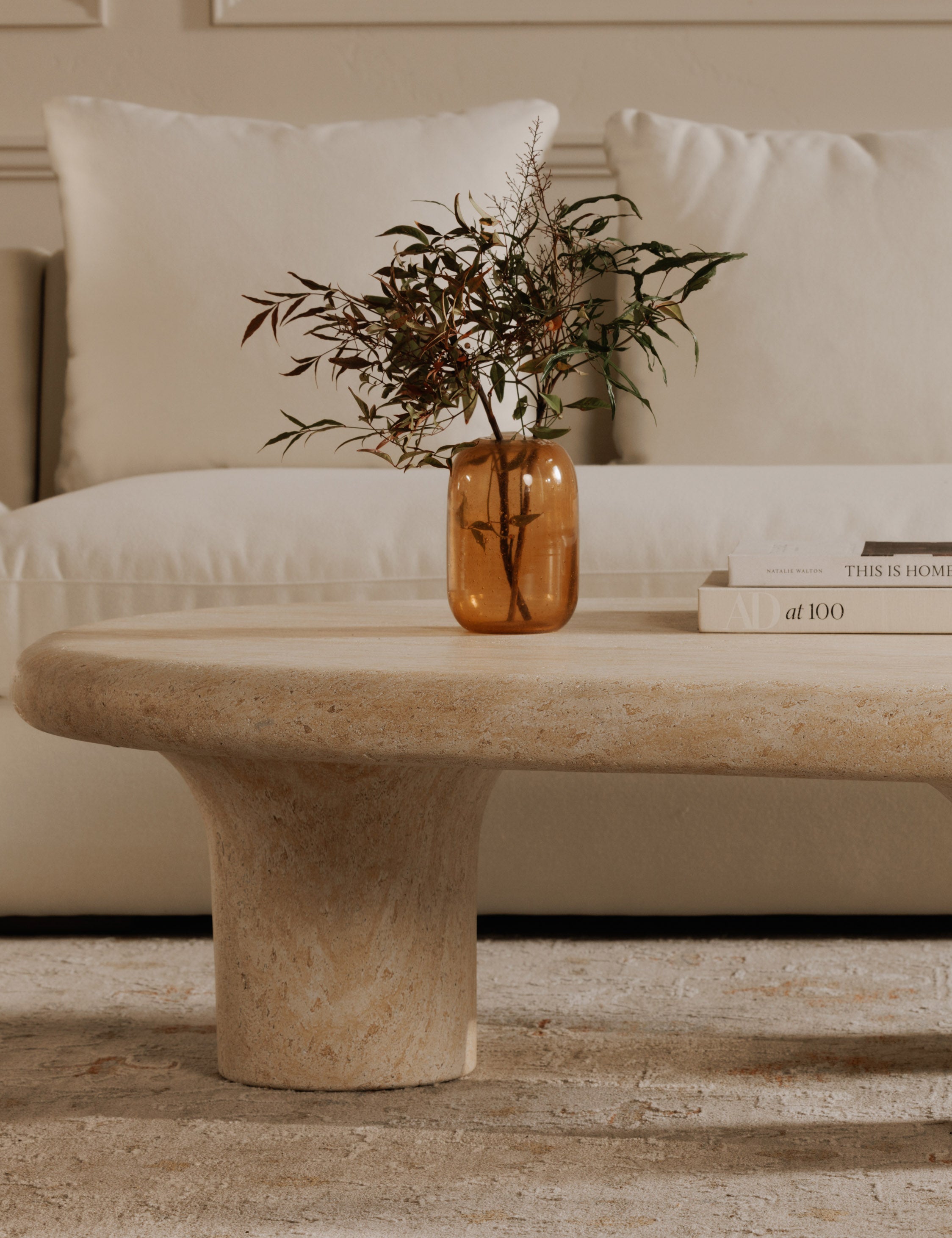 Bertie amber bubbled glass cylinder vase styled on a stone coffee table