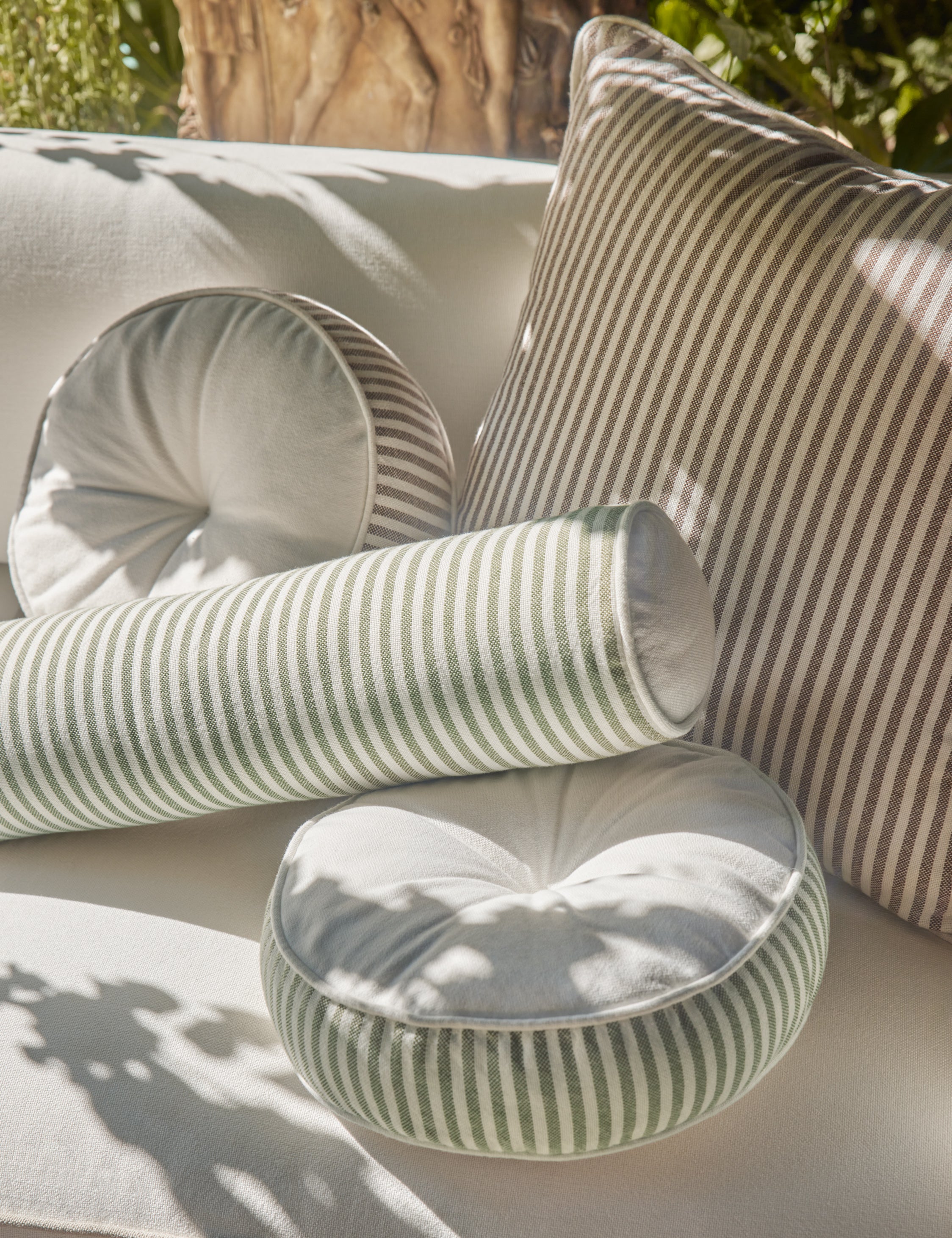Close up of various Littu Pillows by Sarah Sherman Samuel in different colors and sizes.