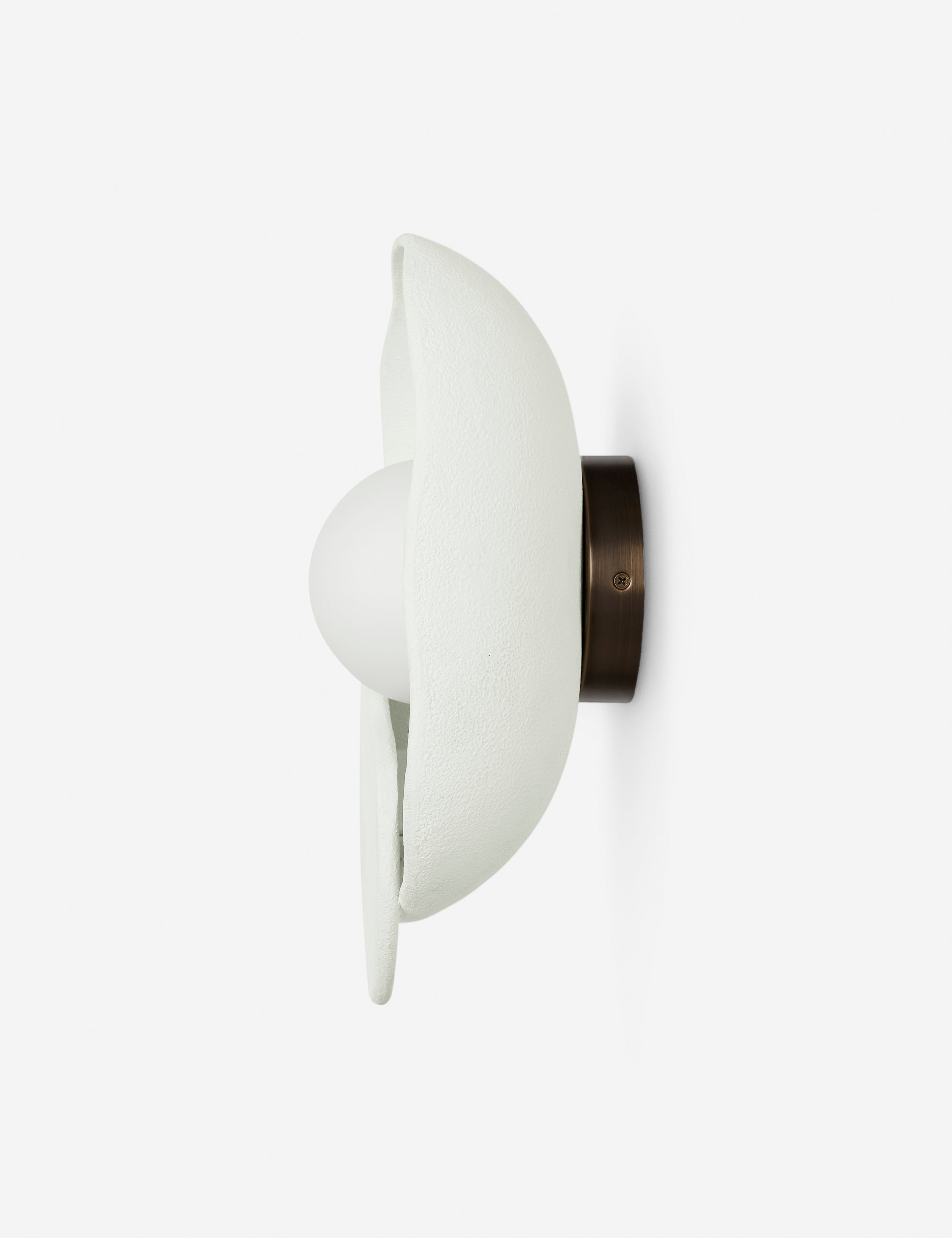 Side view of the Soft Petal matte white floral silhouette wall sconce light