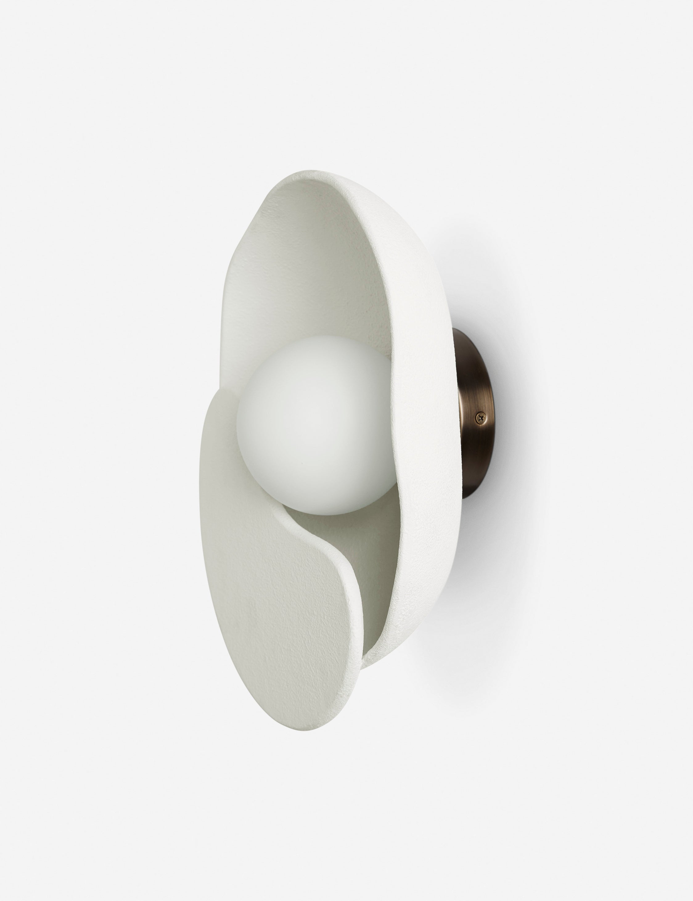 Angled view of the Soft Petal matte white floral silhouette wall sconce light