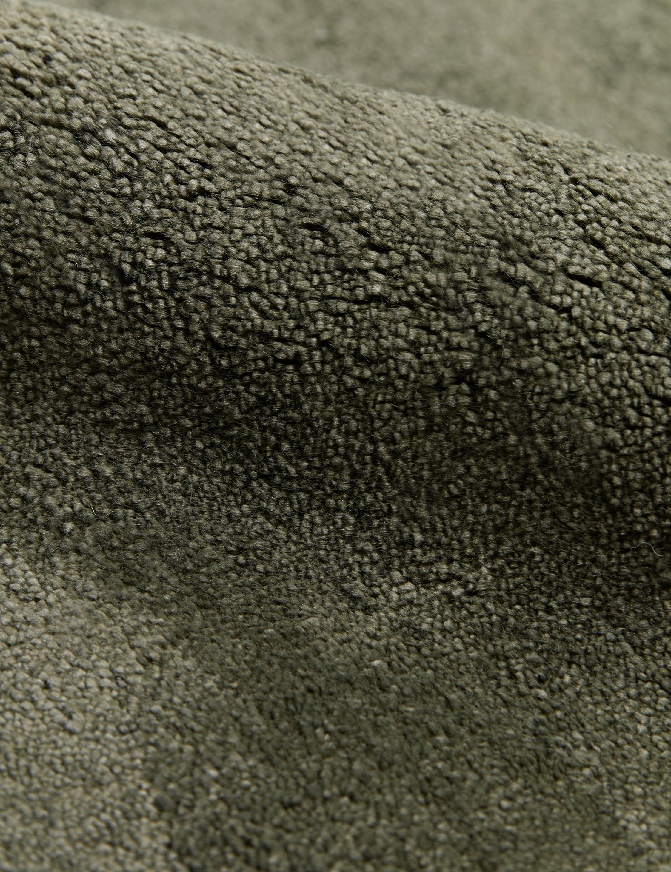 Close up view of the Sutton Solid Color Hand-Loomed Viscose Rug by Aimee Song