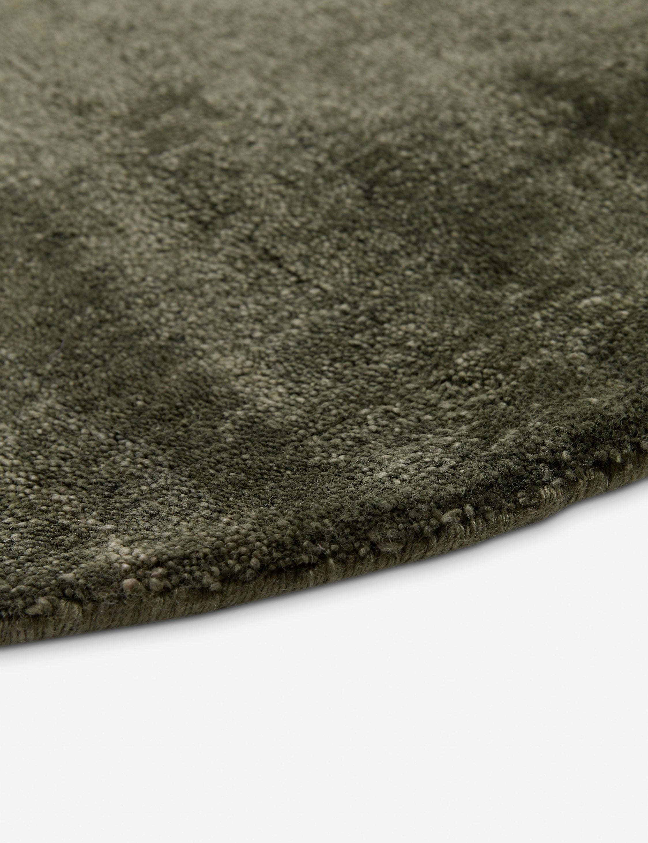Close up view of the Sutton Solid Color Hand-Loomed Viscose Rug by Aimee Song