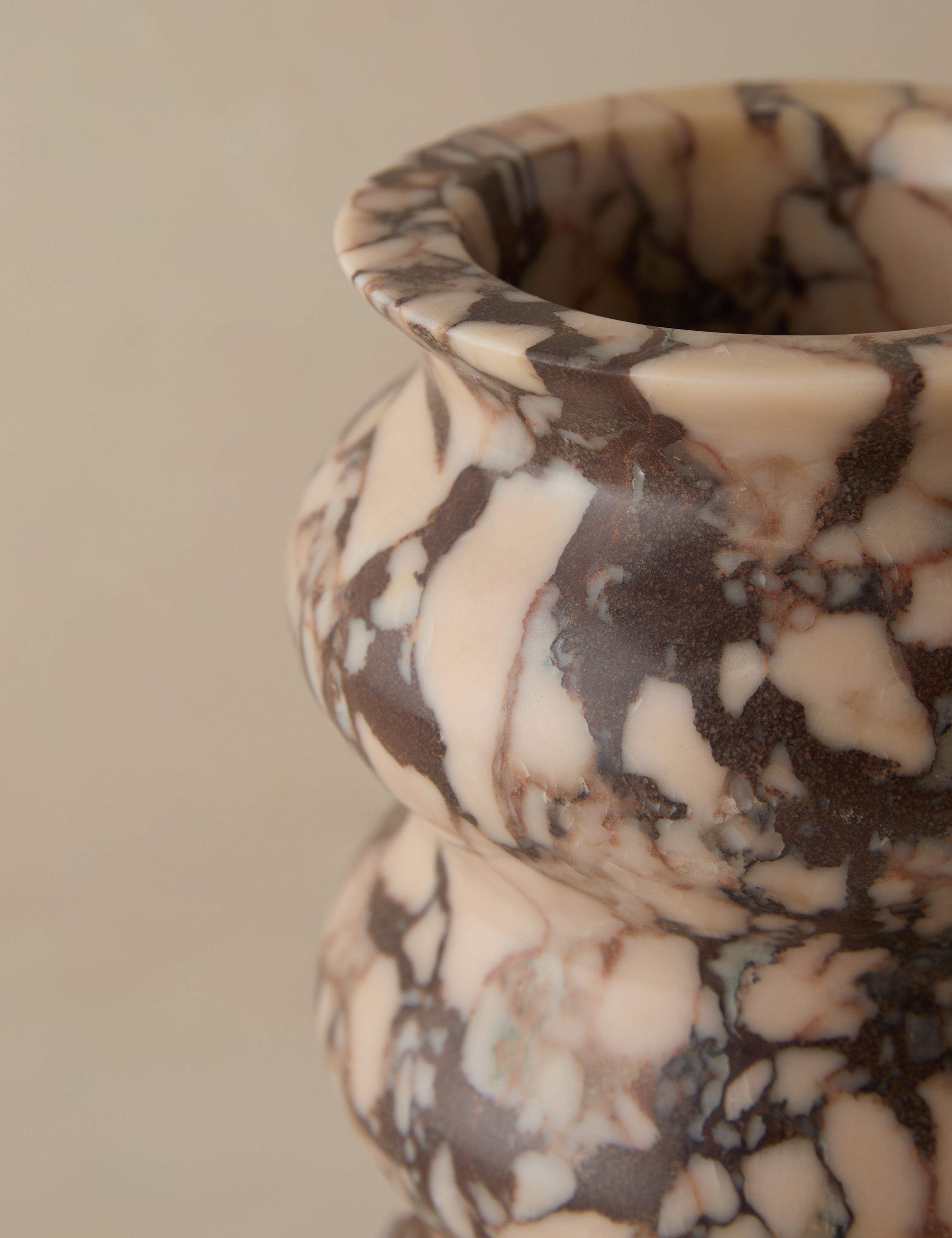 Close up of the Zainab hand-carved marble vase