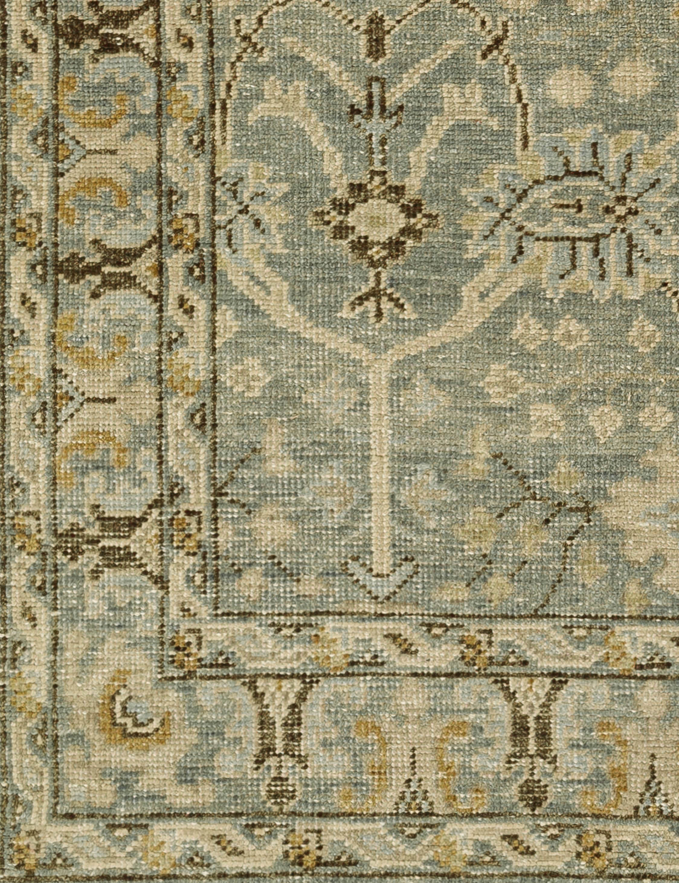 Close up of the Quintero traditional motif hand-knotted wool rug