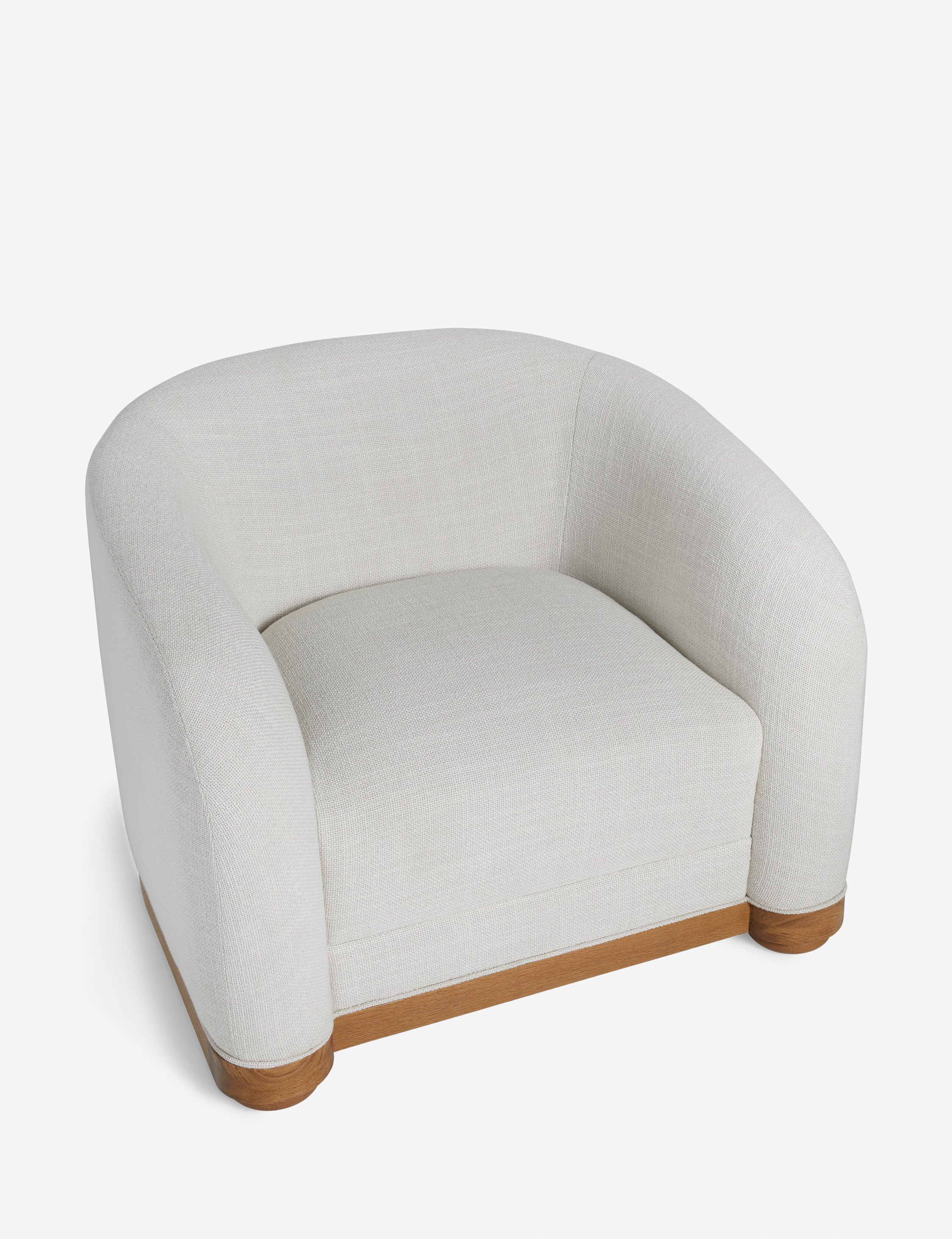 Angled overhead view of the Marci off white low barrel design accent chair