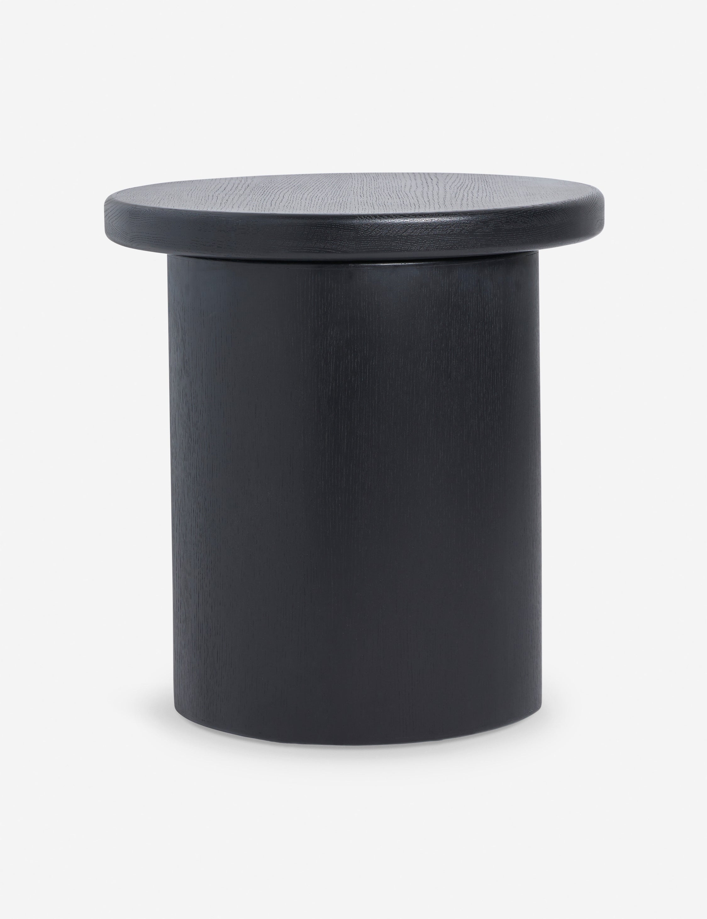Side view of the Olga round modern black oak side table