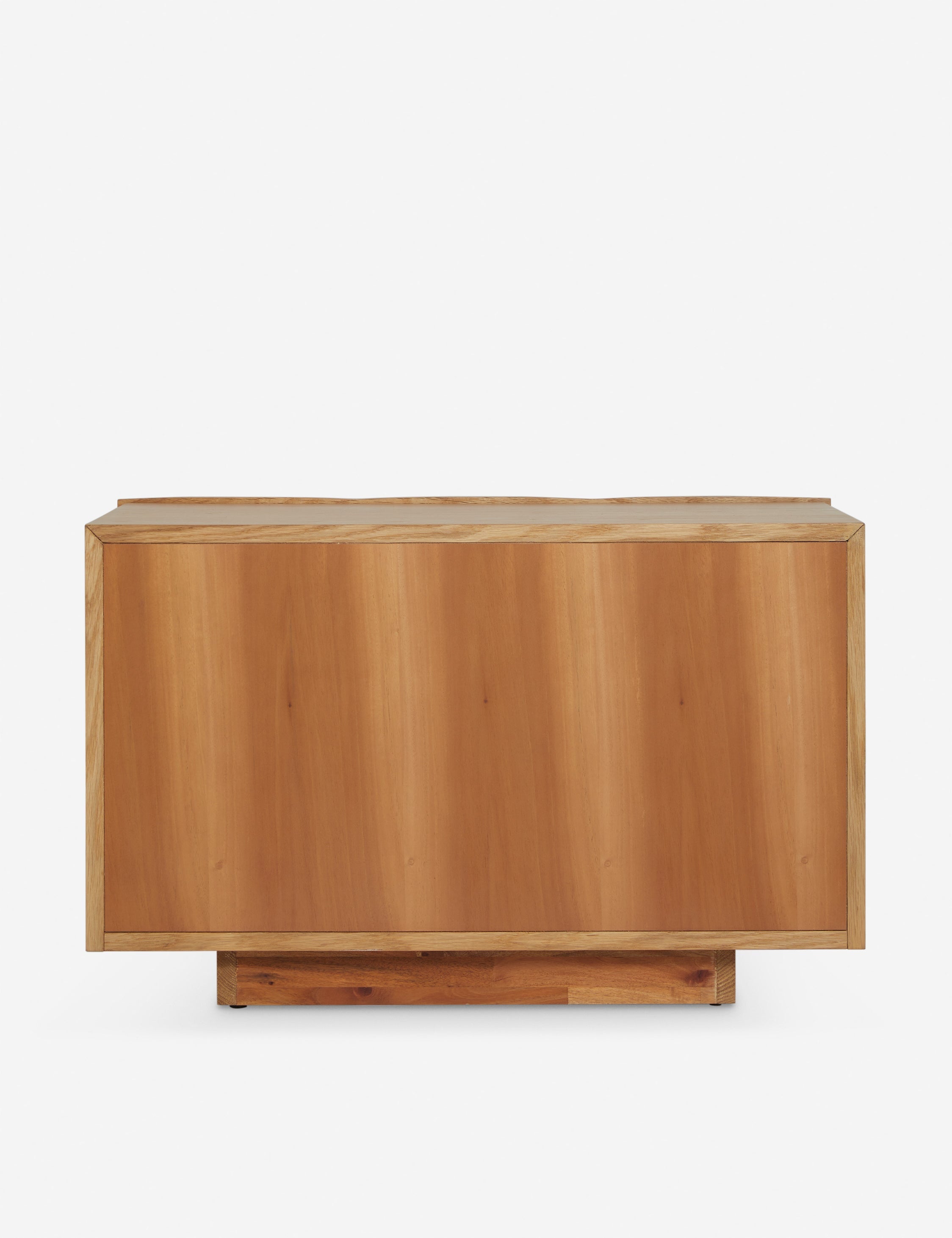 Back of the Otelia wide profile two drawer nightstand in natural wood