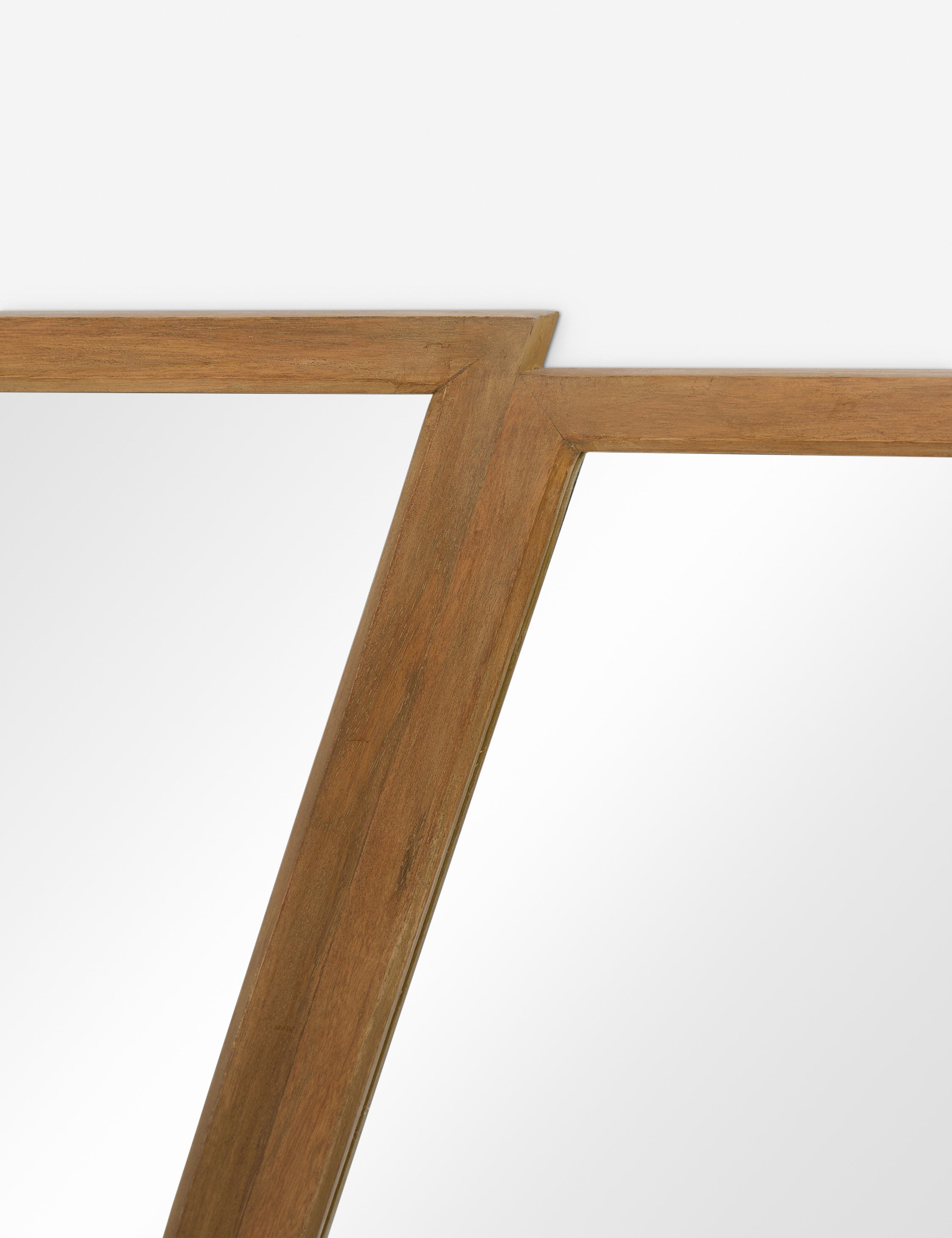 Close up of the frame of the Rima diptych design angled frame wall mirror.