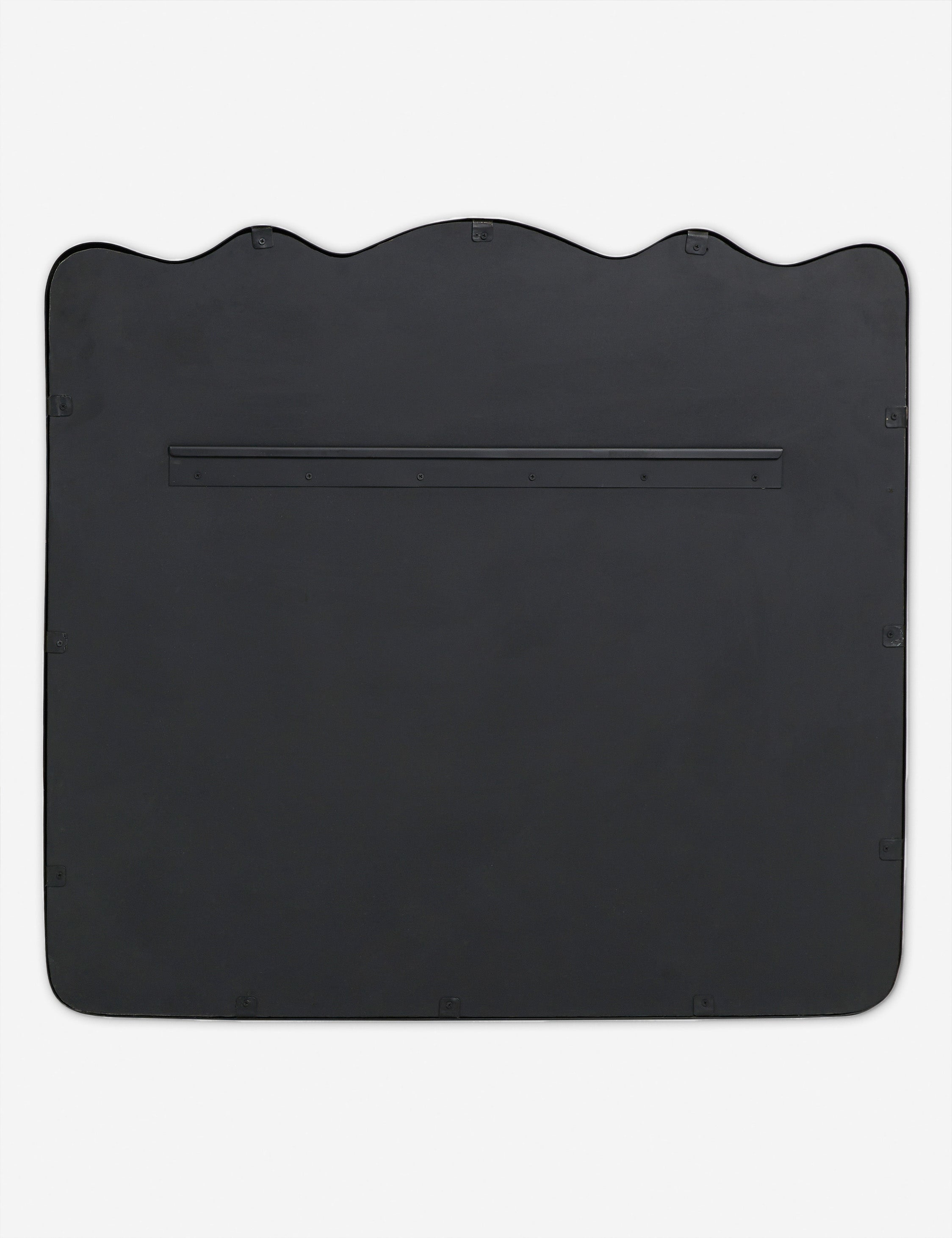 Back of the Rook wavy slim frame mantel mirror in charcoal