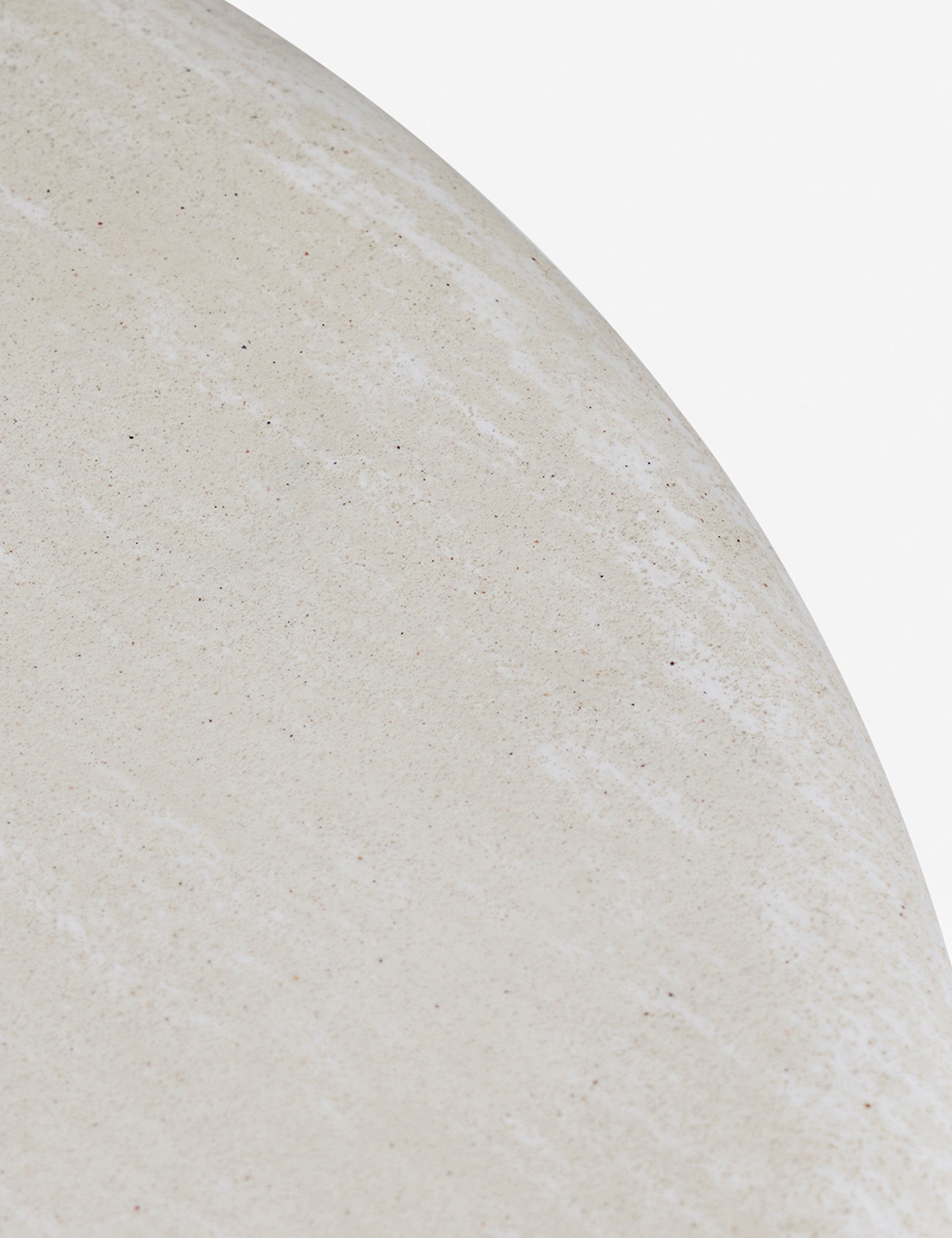 Close up of the Ruiz round cement outdoor side table.