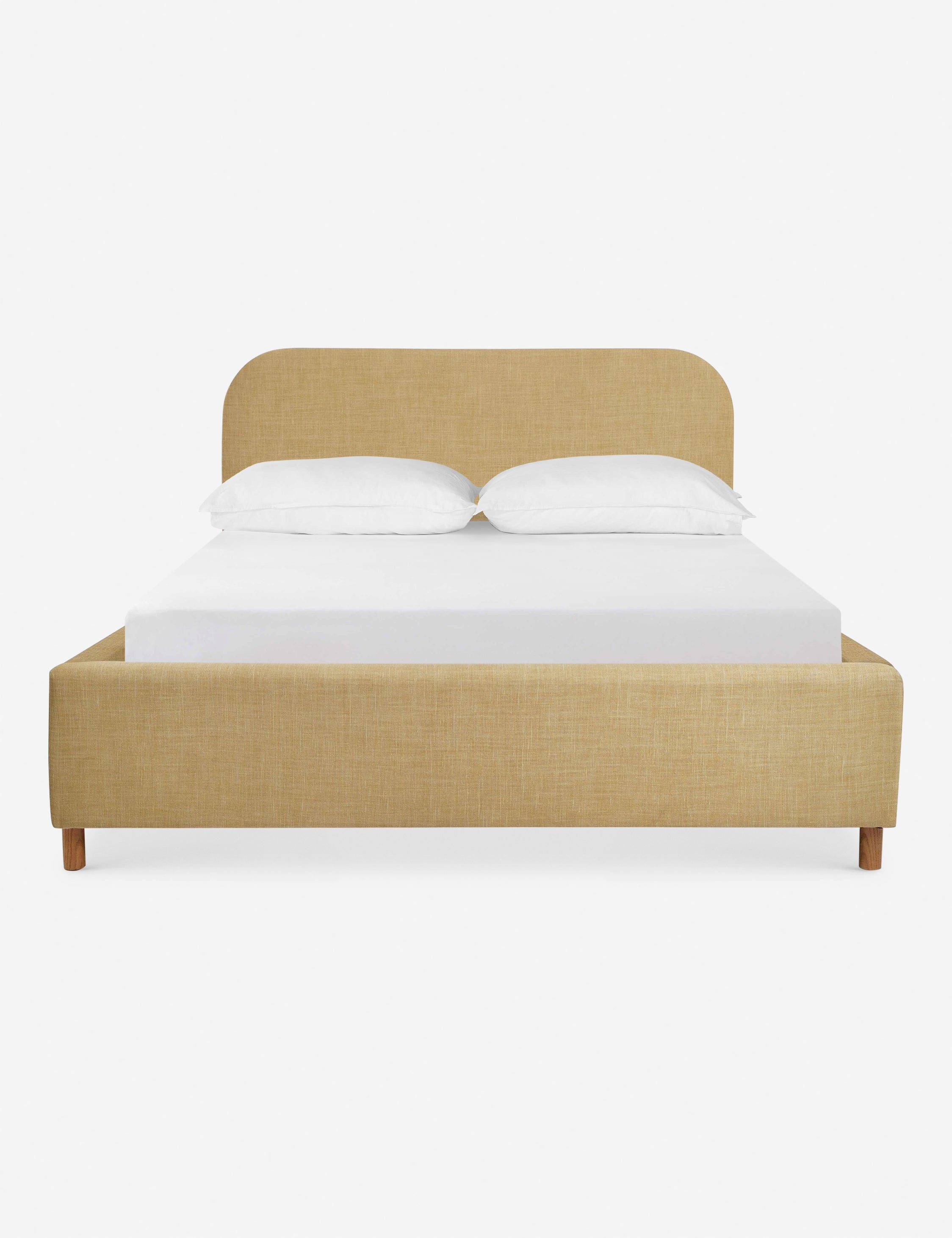 Solene Wheat yellow linen platform bed with an arched headboard and oak wood legs