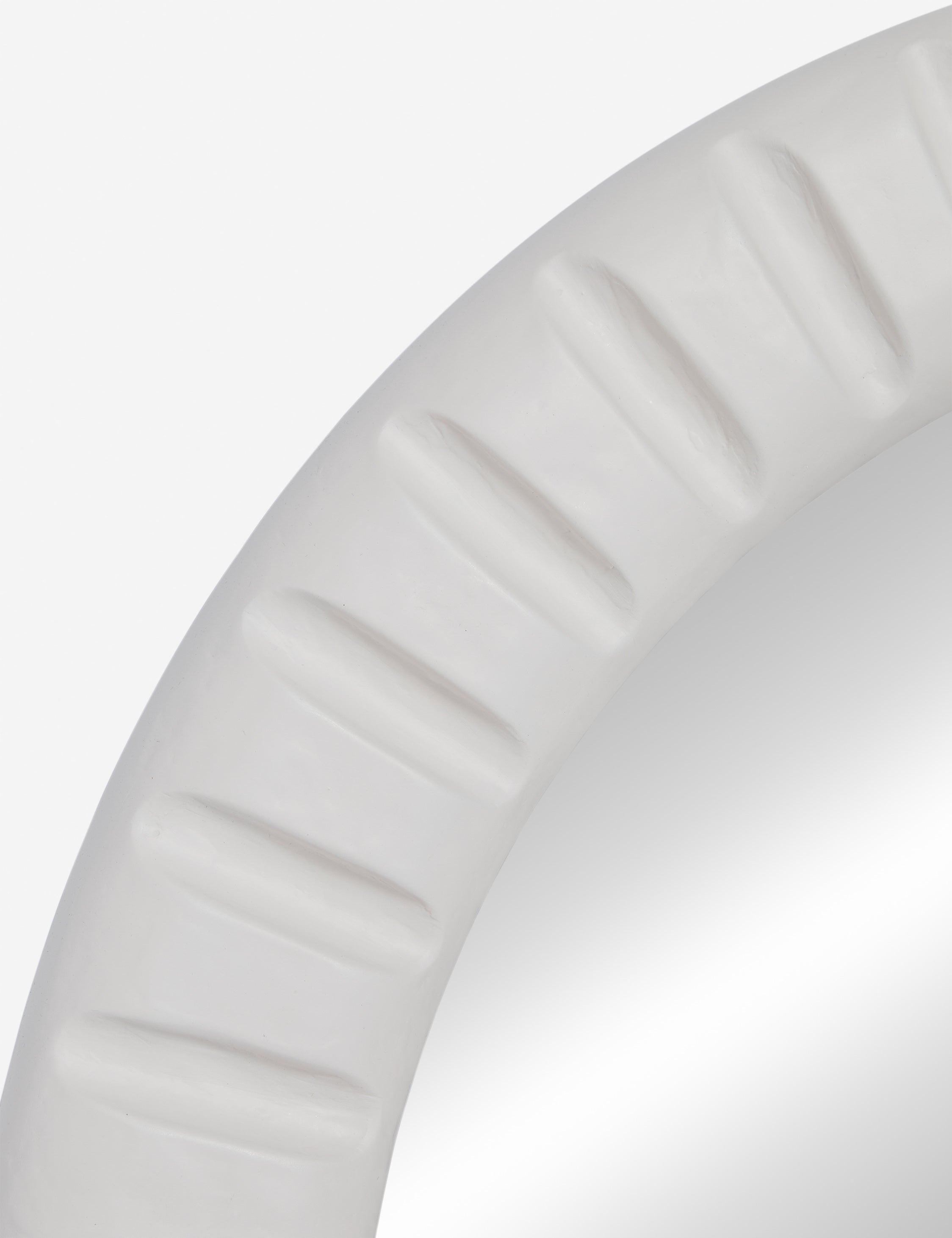Close up of the Tapp white framed round wall mirror