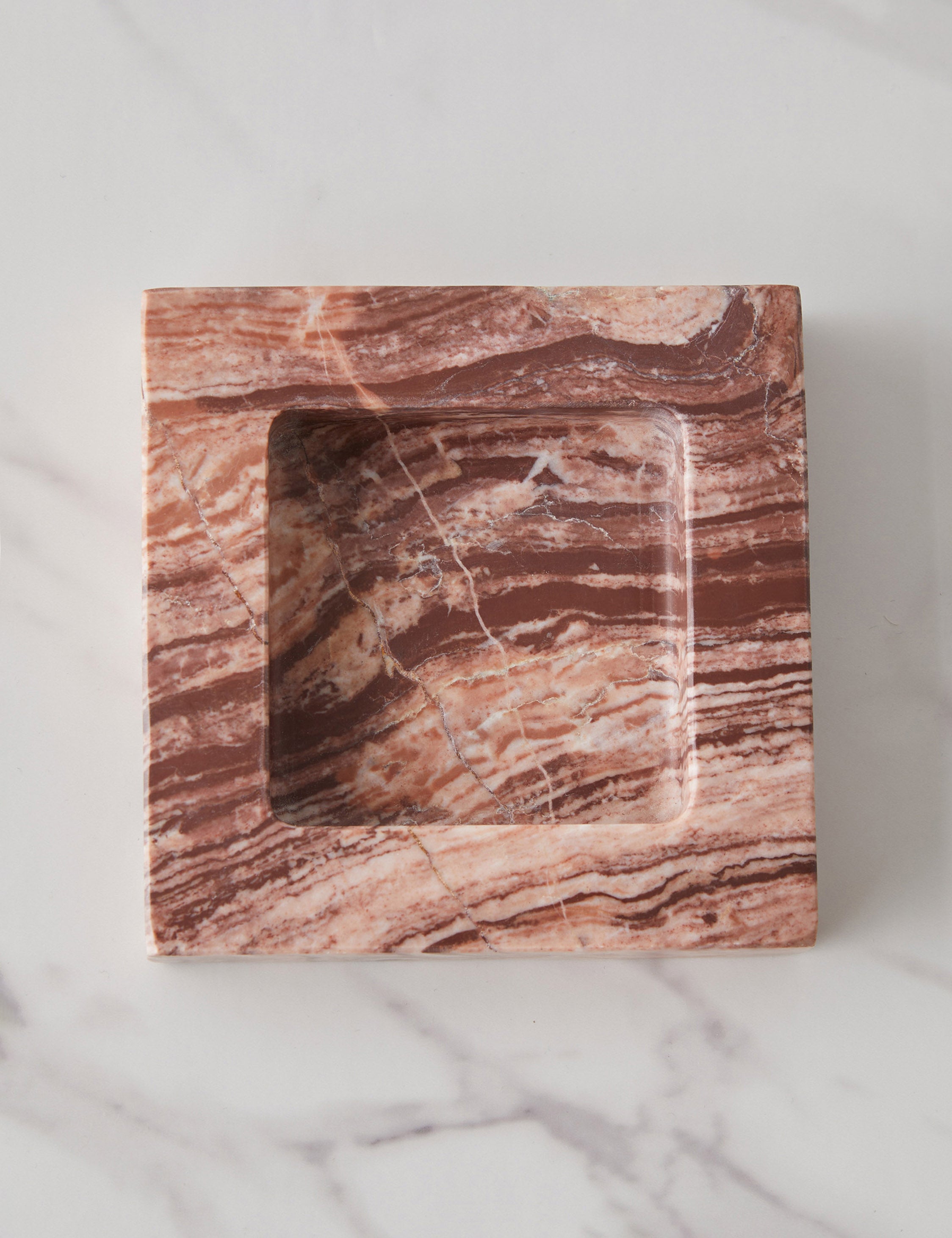 Teo catchall square tray in pink marble holding lipsticks