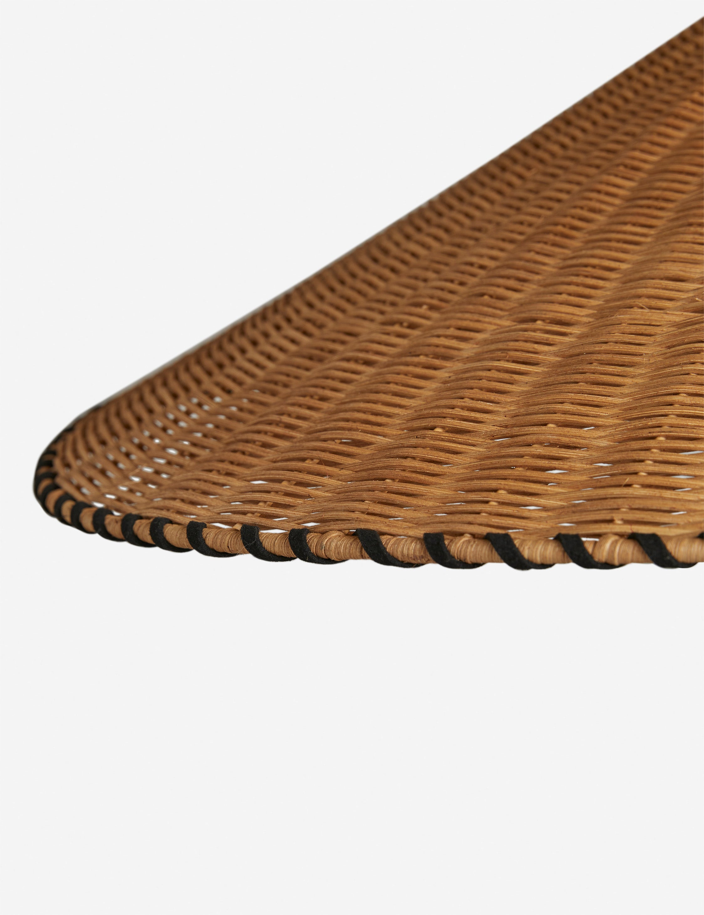 Close up view of the shade of the Terrene Woven Rattan Pendant by Elan Byrd.