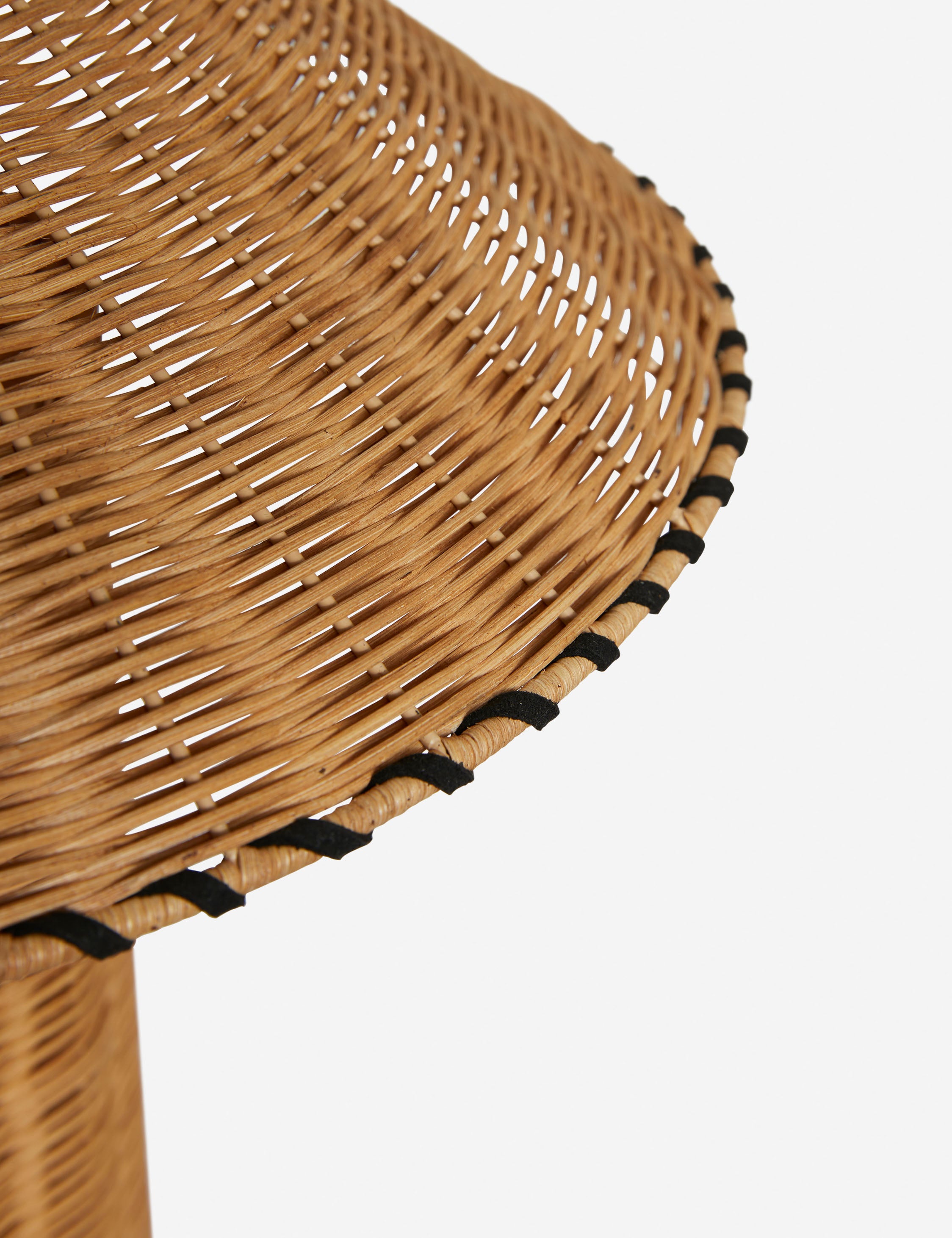 Close up of the shade of the Terrene Woven Rattan Table Lamp by Elan Byrd.