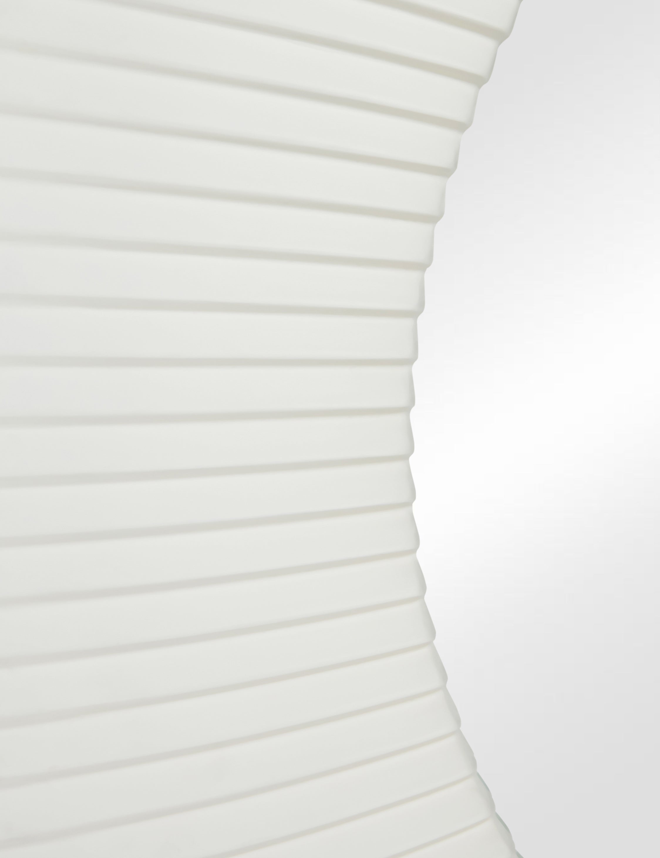 Close up of the Whitaker white asymmetrical oval wall mirror.