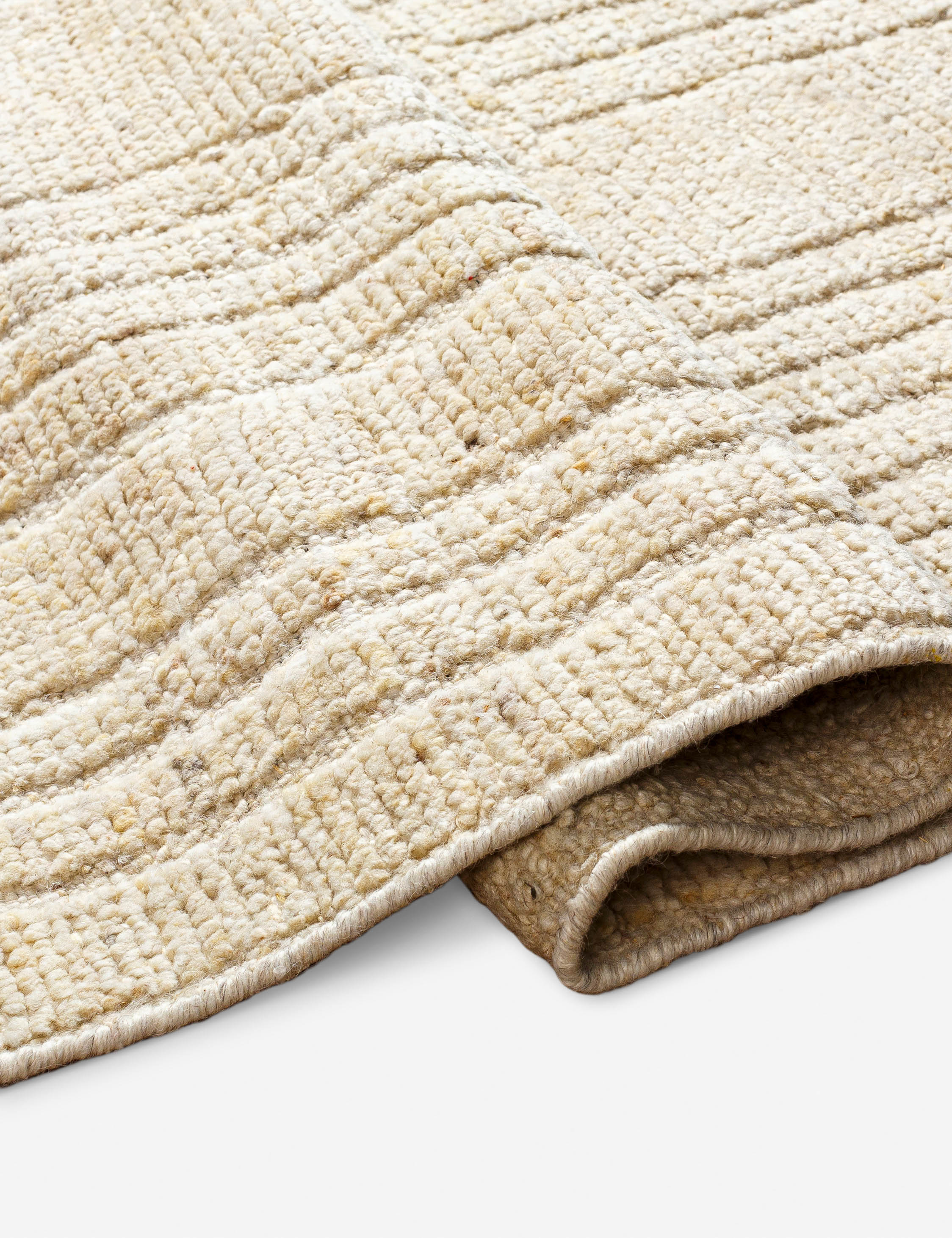 Close up view of the Malone textured ivory hand-knotted wool runner rug
