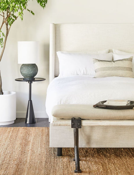 #color::white #size::euro-sham #size::standard #size::king | The Set of two european flax linen white pillowcases by cultiver sit on a natural linen framed adara bed in a bedroom with a jute rug and a shiny black nightstand