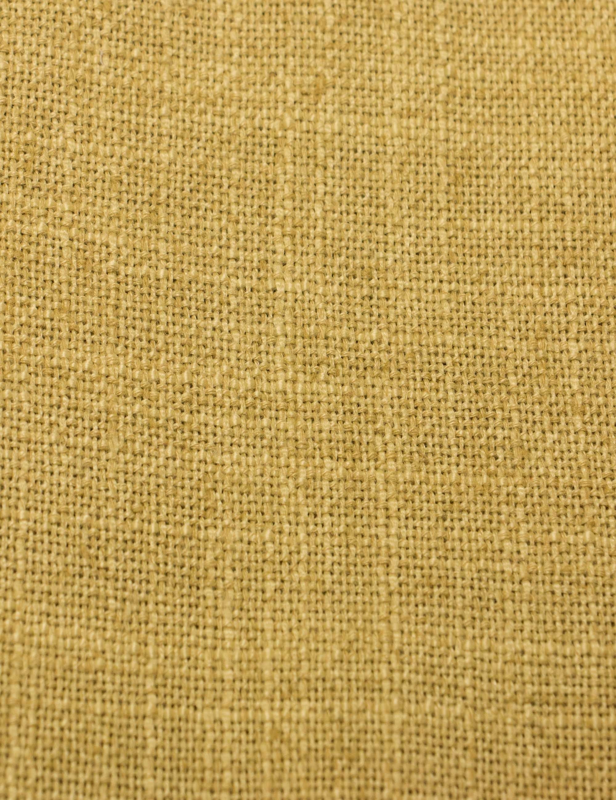 Detailed shot of the yellow linen on the Adara yellow linen upholstered bed.