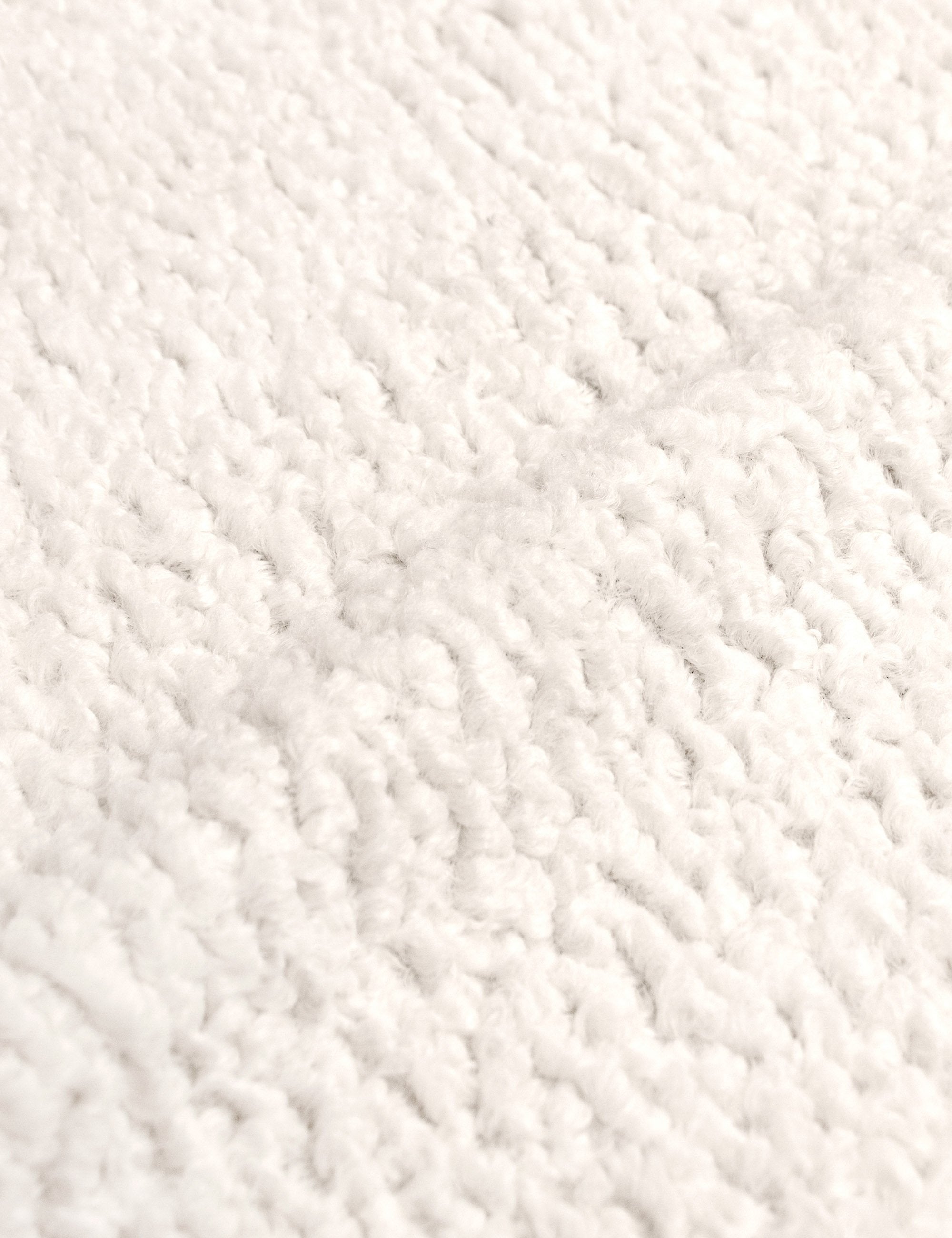 The Cream Sherpa fabric on the Bailee ottoman