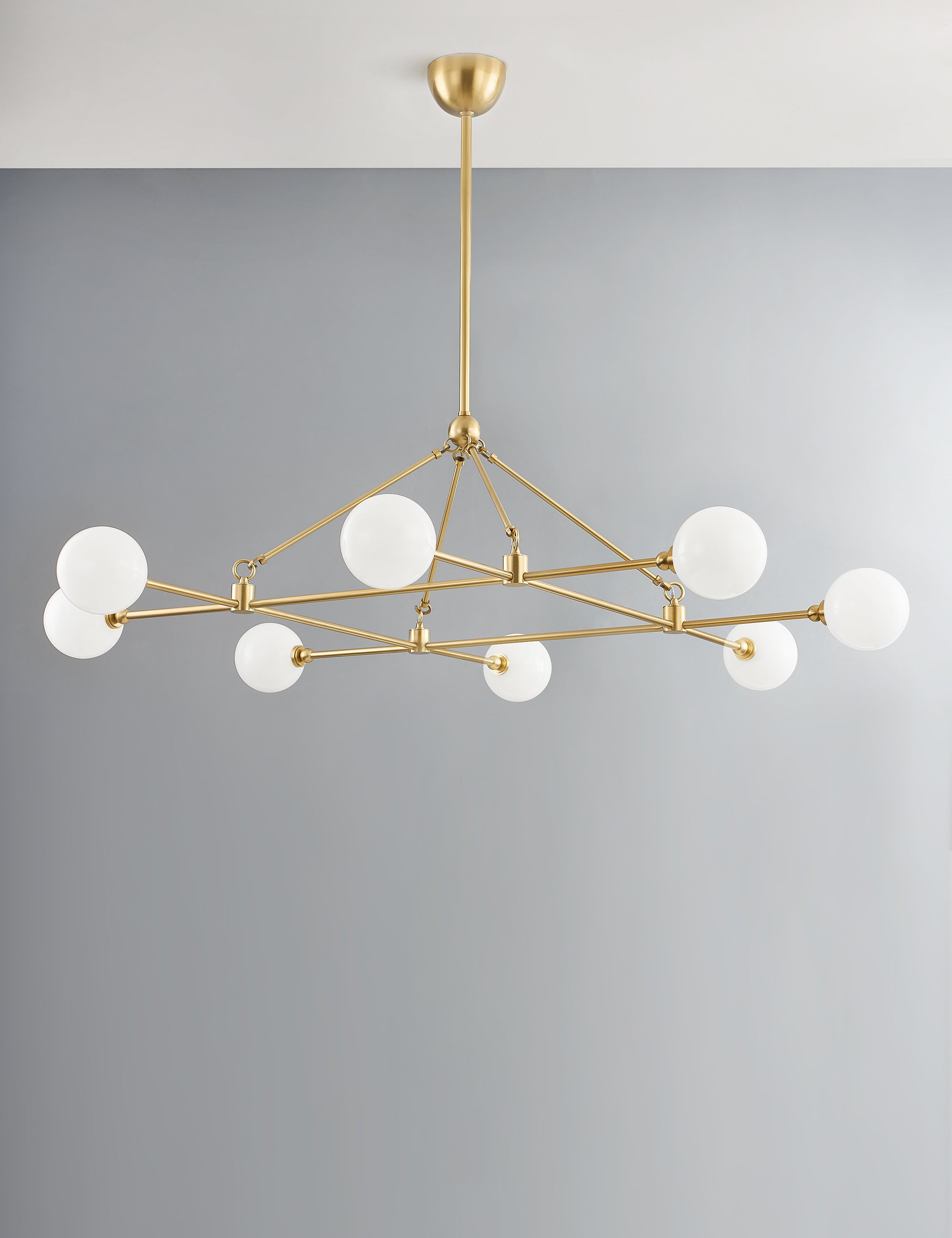 Helia slim frame modern brass chandelier.